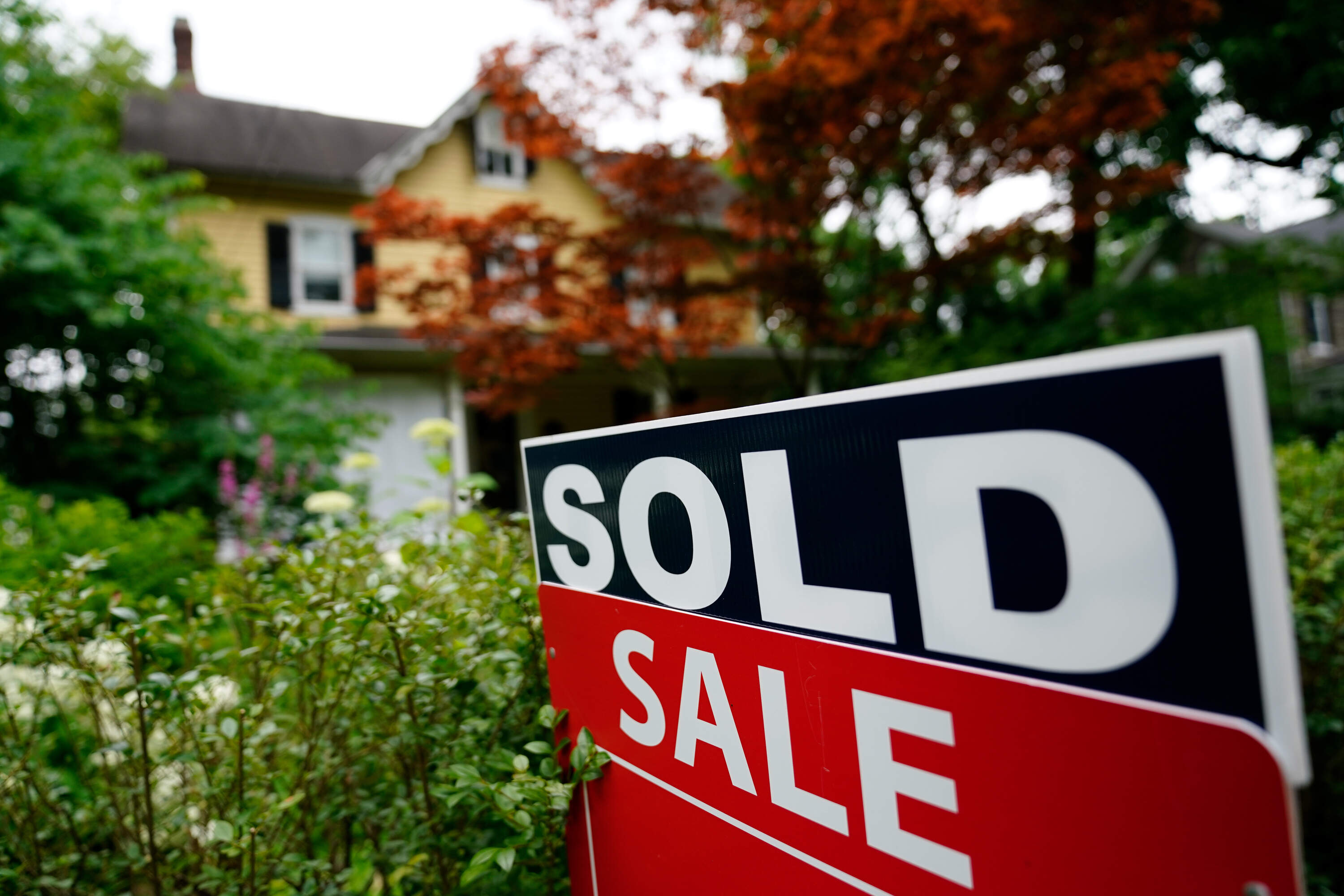 A sale sign stands outside a home in Wyndmoor, Pa., Wednesday, June 22, 2022. (Matt Rourke/AP)