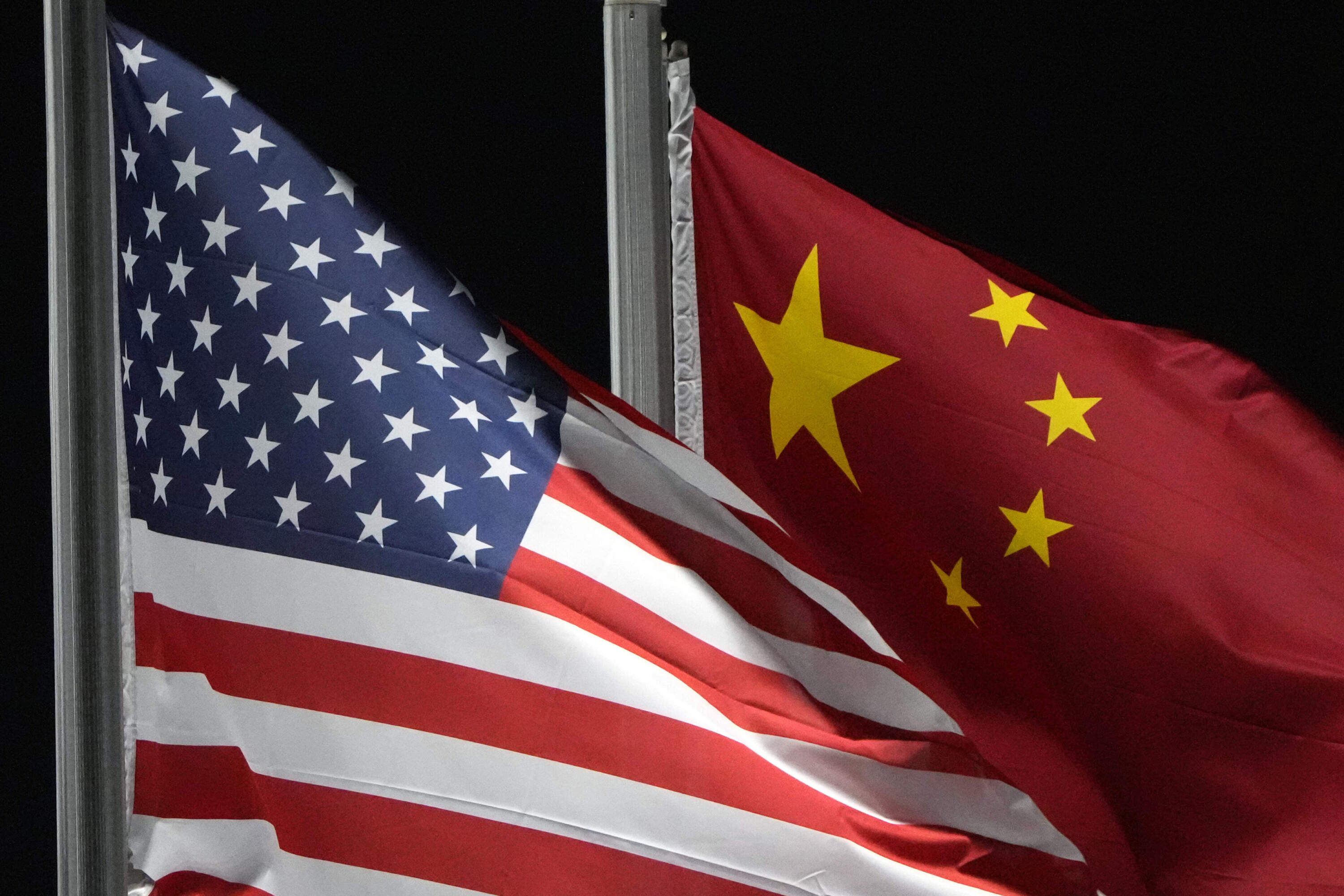 American and Chinese flags wave in Zhangjiakou, China. (Kiichiro Sato/AP)