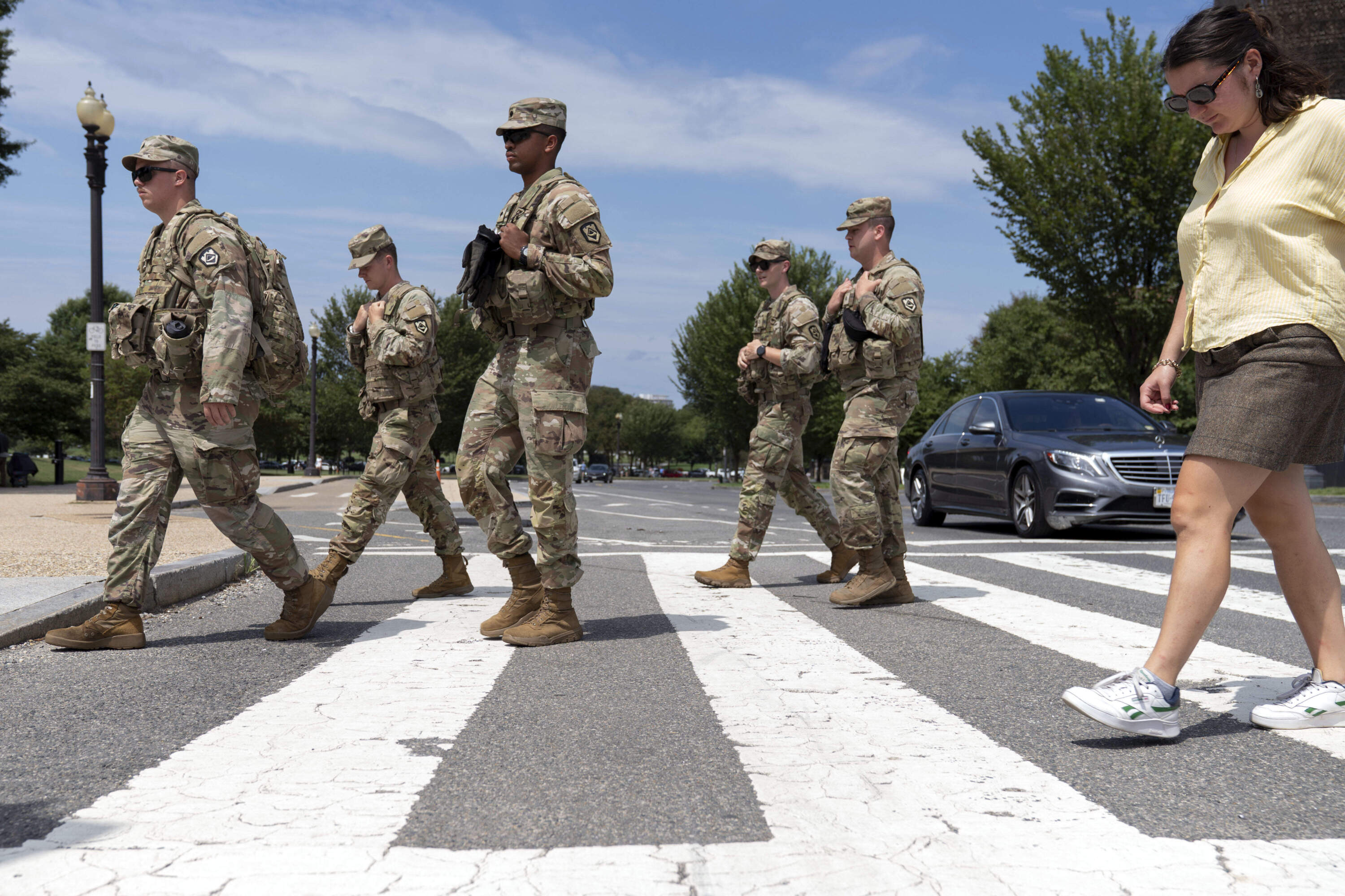 Members of the West Virginia National Guard patrol the National Mall, Sunday, Aug. 24, 2025, in Washington, D.C. (Jose Luis Magana/AP)