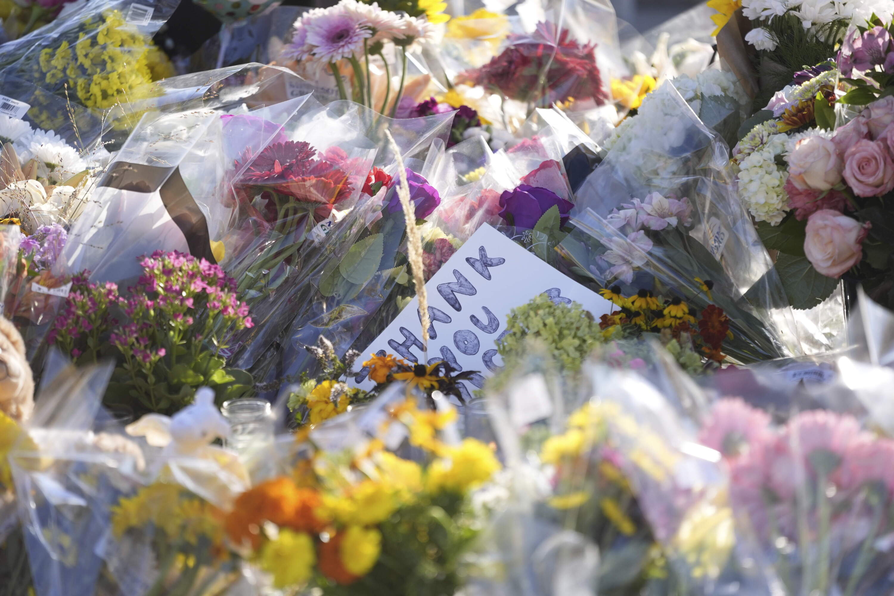 Flowers and notes are placed at a memorial at Annunciation Catholic Church after Wednesday's school shooting, Thursday, Aug. 28, 2025, in Minneapolis. (Abbie Parr/AP)
