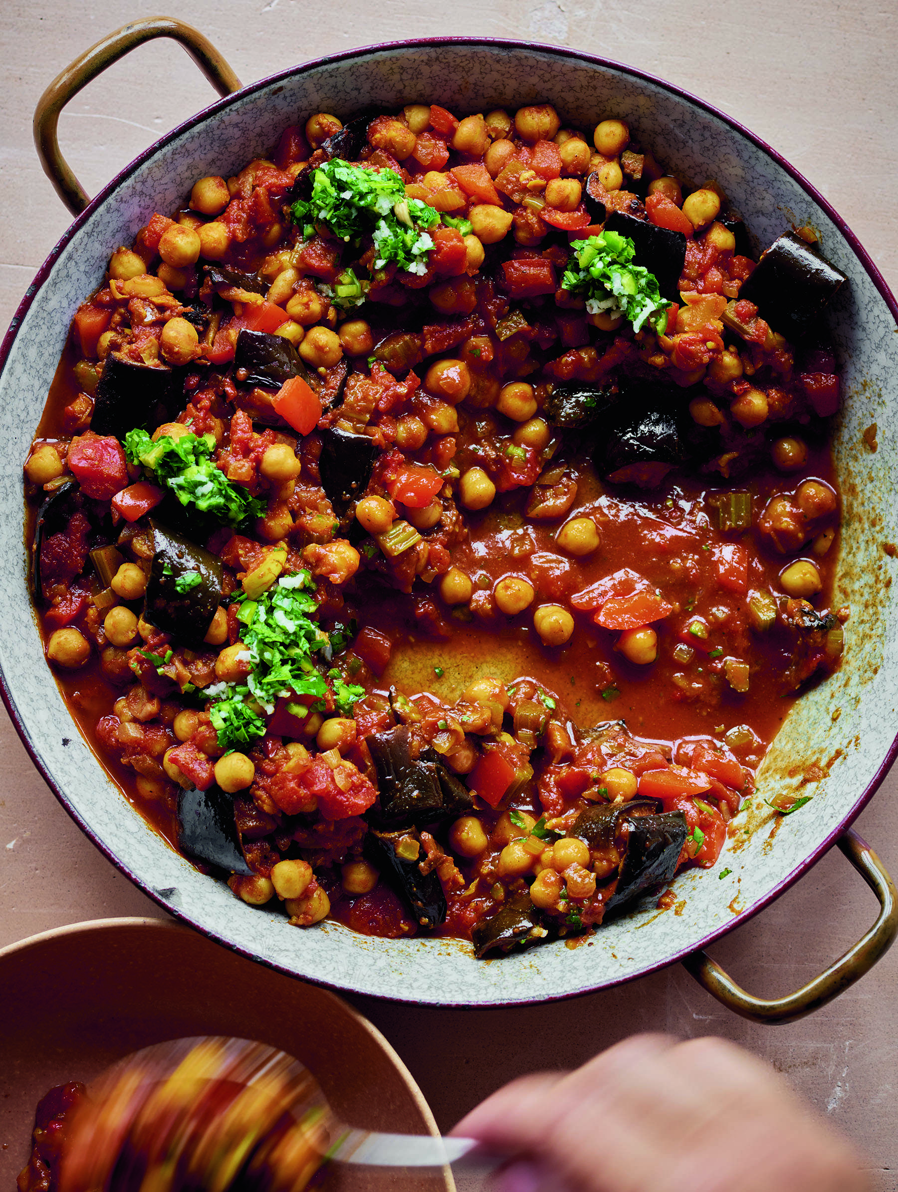Eggplant and chickpeas with green lemon sauce. (Courtesy of Issy Crocker)