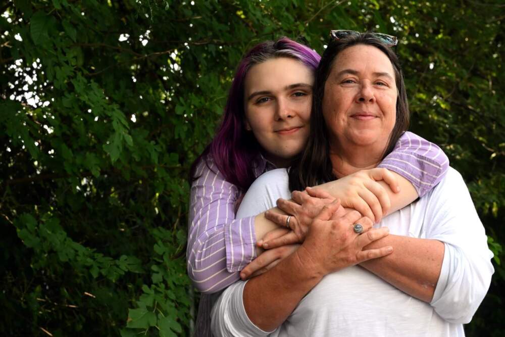 June Carpenter, 18, with her mother Melissa Combs have serious concerns about the decision to not offer gender affirming care to patients under the age of 19. (Joe Amon/Connecticut Public)