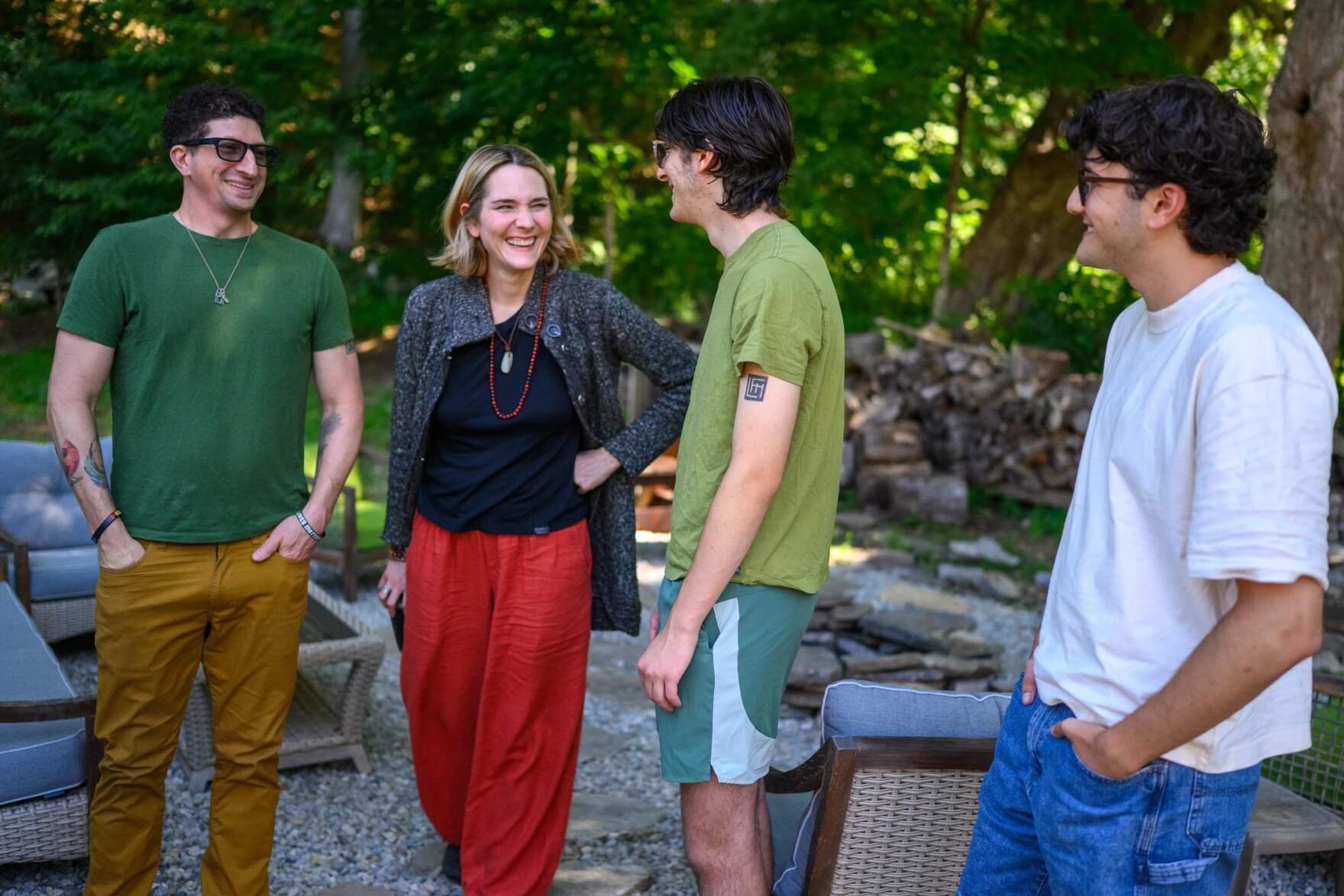 From left Micha, Sara, Asher and Daniel Heumann hang out in their home’s yard. (Mark Mirko/Connecticut Public)