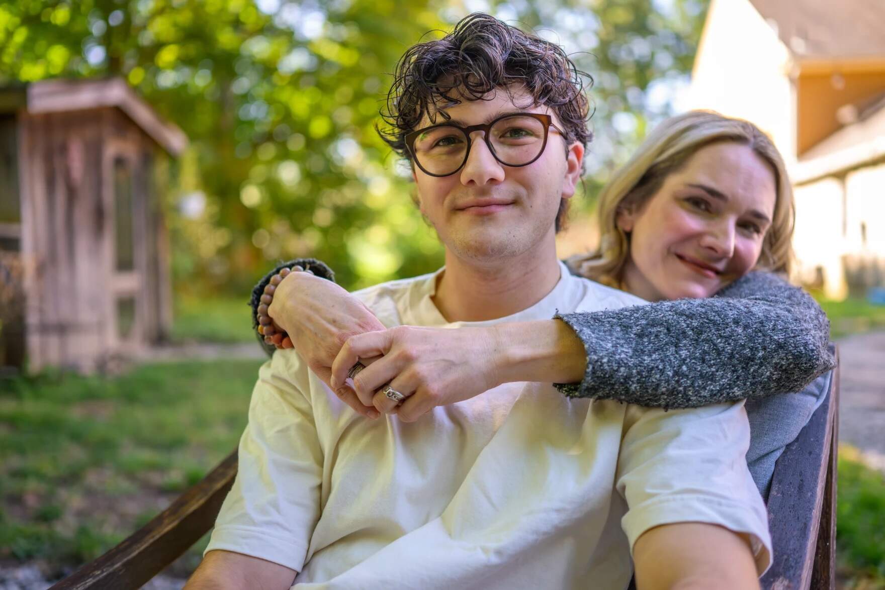 Sara Heumann hugs her son 20-year-old son Daniel who began transitioning to male at 7. (Mark Mirko/Connecticut Public)