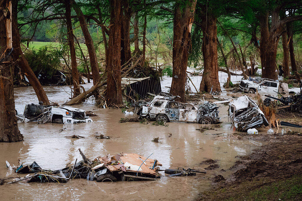 Wrecked vehicles and trailers along the Guadalupe River in Kerrville, Texas, on Sunday, July 6. (Desiree Rios for The Washington Post via Getty Images)