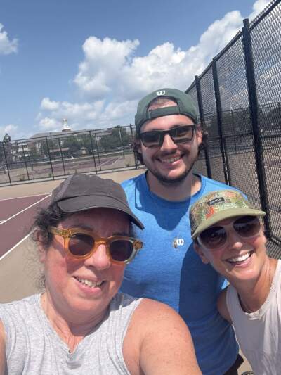 The author, in the black hat, and her tennis instructor Nick and friend, Allison, on the a court in Maine. (Courtesy Kathy Gunst)