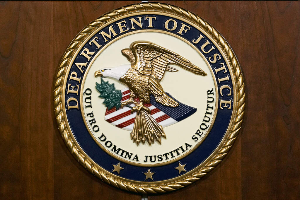 The seal of the Department of Justice is shown in Washington, Aug. 1, 2023. (J. Scott Applewhite/AP File)