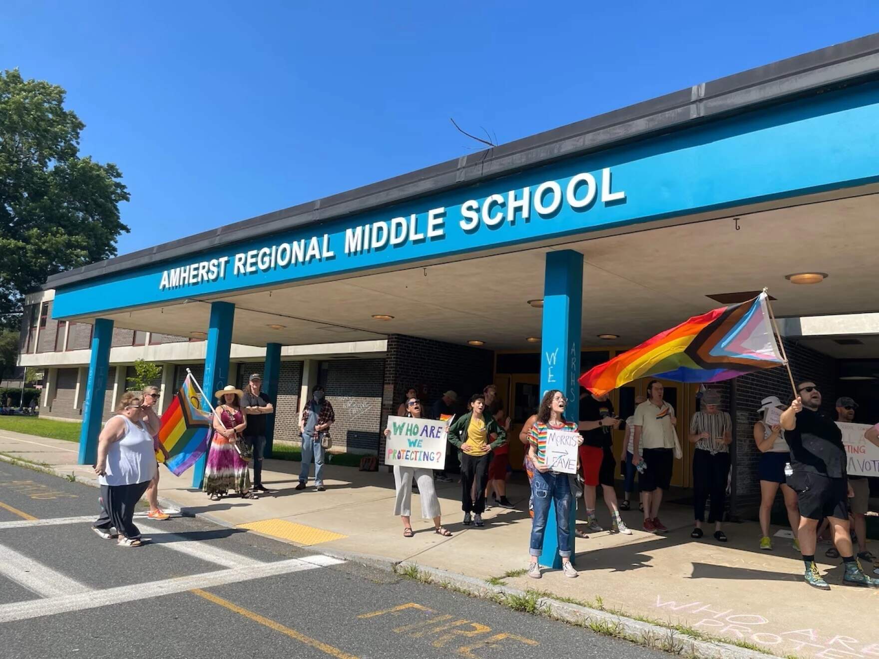 A rally was held in July 2025 at the middle school in Amherst, Mass., in support of LGBTQ+ students. (Juliet Schulman-Hall/ MassLive via NEPM)