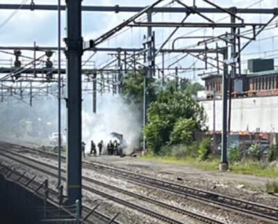 Crews respond to the burning signal bungalow. (Courtesy of Keolis)