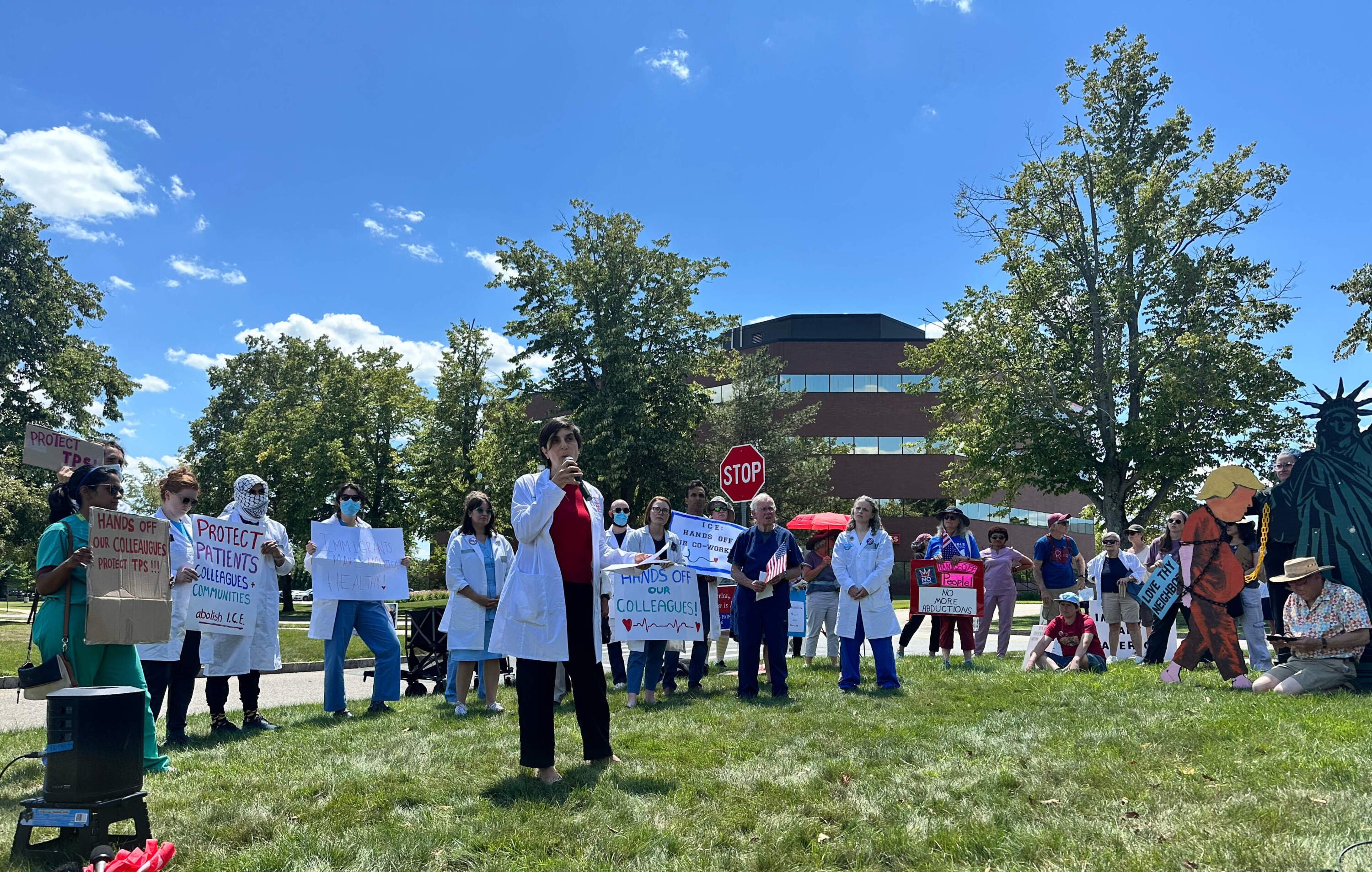 Dr. Lara Jirmanus, founder of the Health and Law Immigrant Solidarity Network, was among a group of physicians who protested in front of ICE’s regional headquarters in Burlington, Massachusetts, in late July. The group is warning of a looming staffing crisis in health care. (Simón Rios/WBUR)