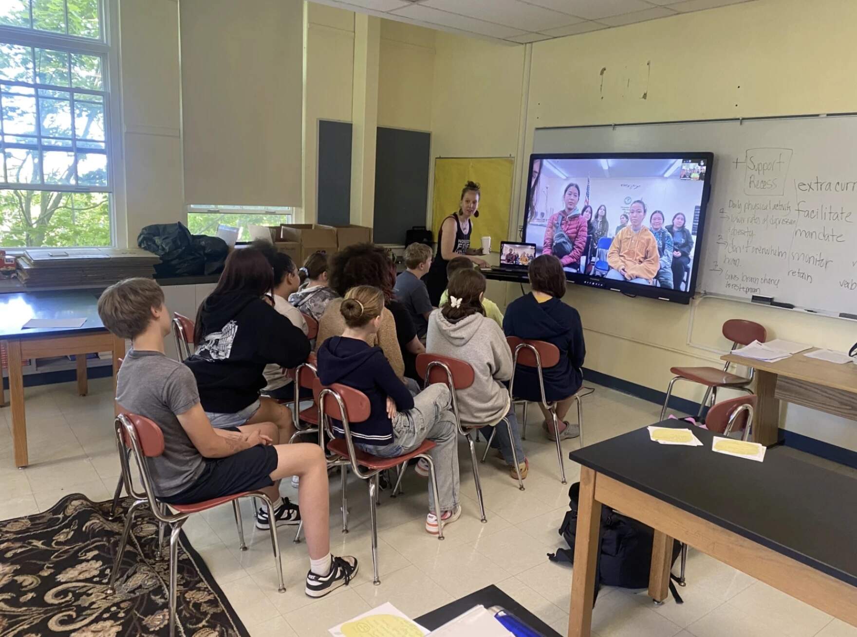 Middle school students and instructor Emily Schiffer in Provincetown IB Schools video call with their pen pals in Mertarvik on June 3, 2025. (Samantha Watson/KYUK)