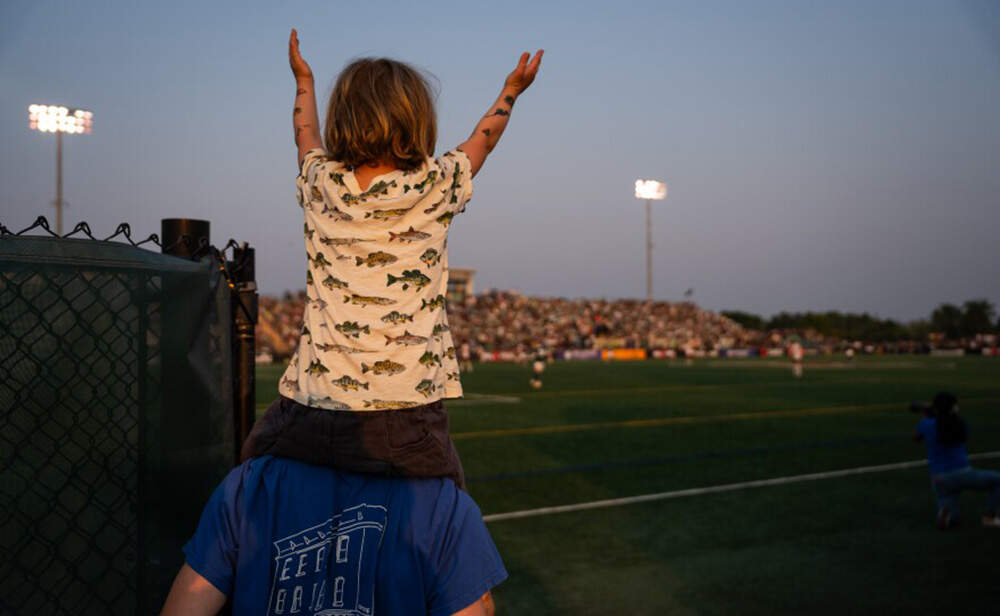 A young fan Vermont FC’s national championship game in Burlington. (Brian Stevenson/Vermont Public)