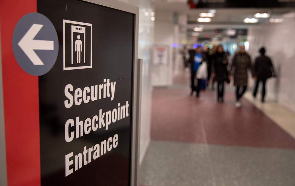 Security checkpoint sign at Logan Airport.