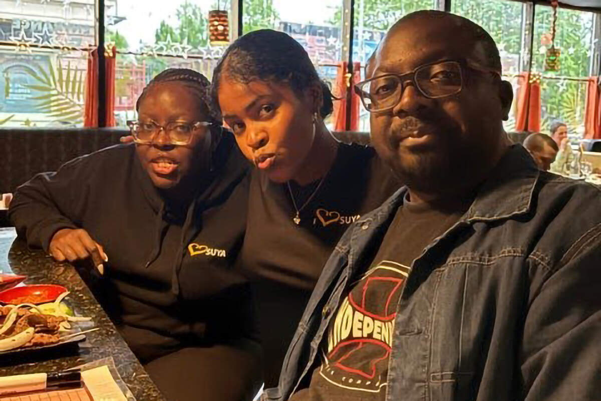 Restaurant owner Cecelia Lizotte with her daughter Vanessa, and brother Paul Dama inside Suya Joint in Roxbury. (Courtesy Cecelia Lizotte)