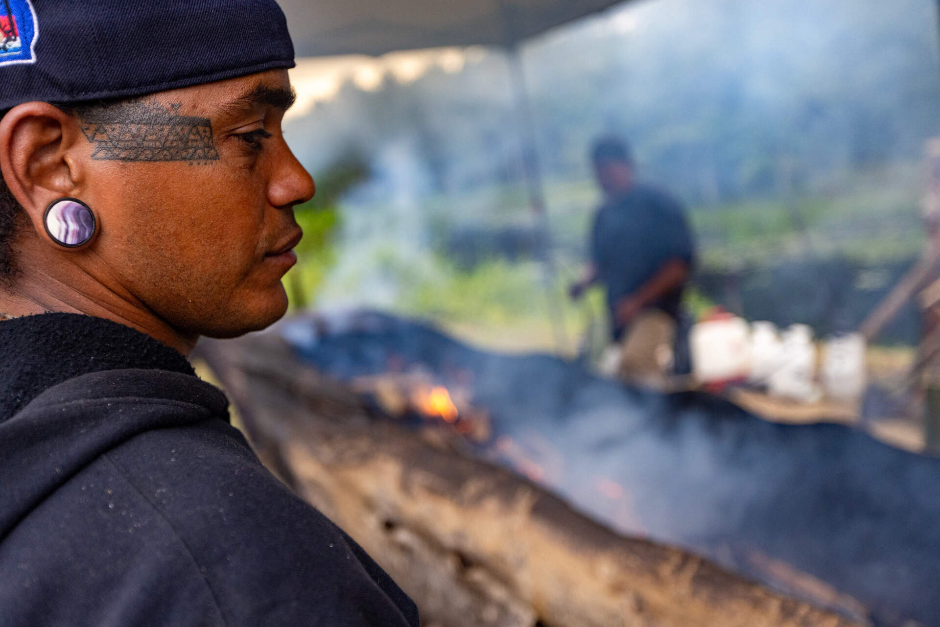 StrongBearHeart at a mishoon burning camp at the Norcross Wildlife Foundation in Wales, Mass. (Jesse Costa/WBUR)