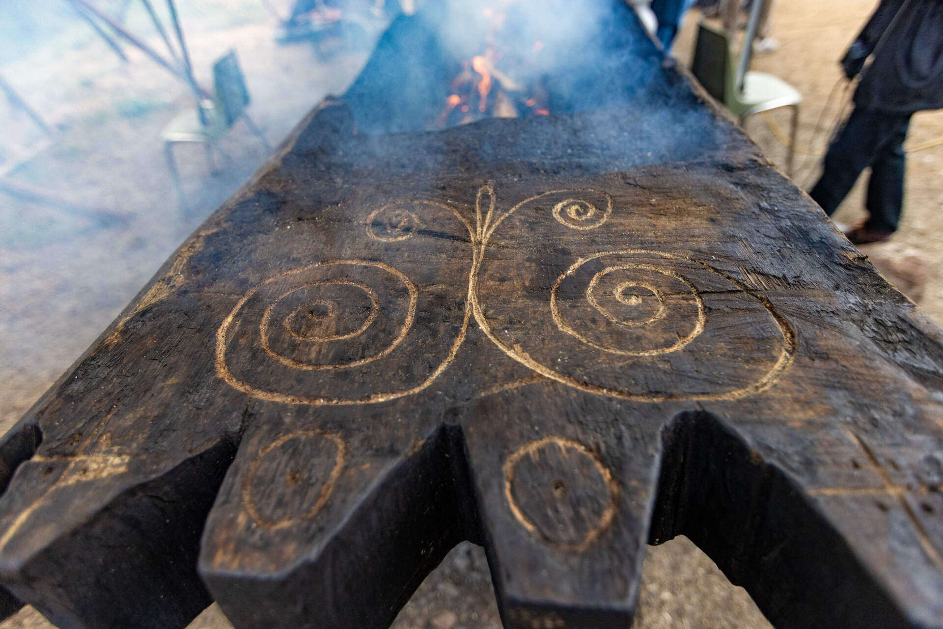 A detailed view of the carvings on the mishoon at the burning camp at the Norcross Wildlife Foundation in Wales, Mass. (Jesse Costa/WBUR)