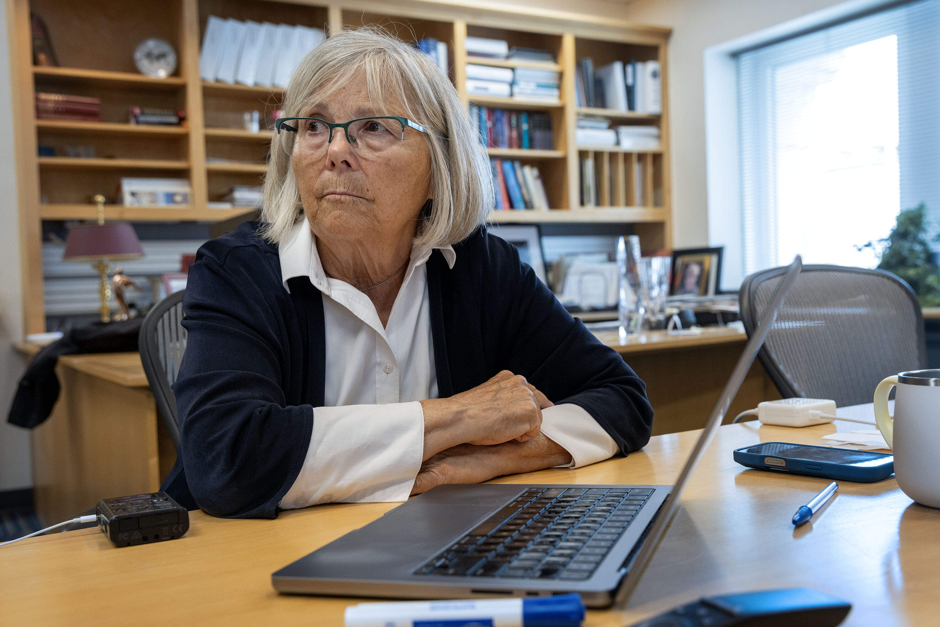 Joan Brugge talks with a visitor in her office at Harvard Medical School. (Robin Lubbock/WBUR)