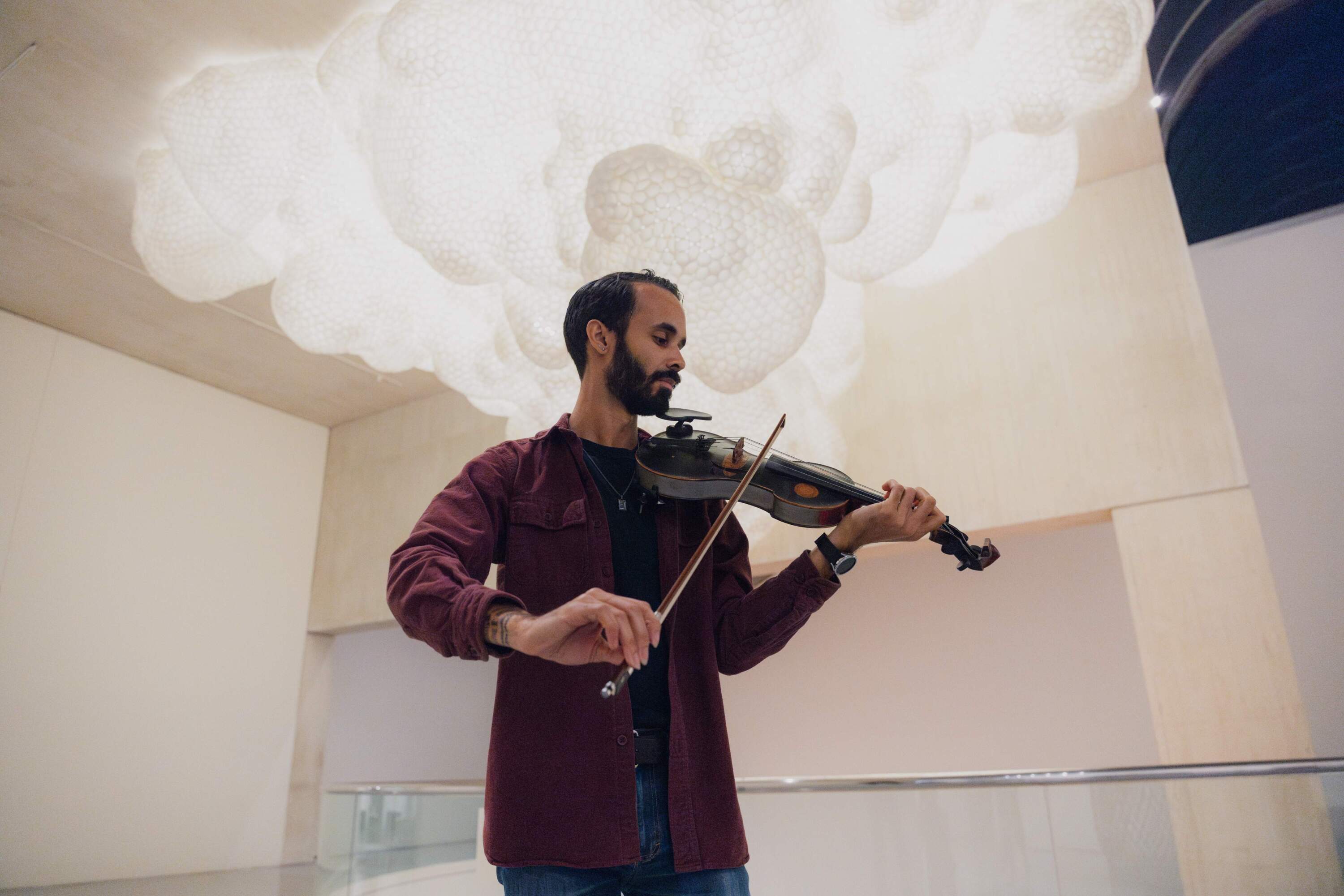 Jake Blount at the Museum of Fine Arts, Boston ahead of a performance. (Olivia Moon for WBUR)