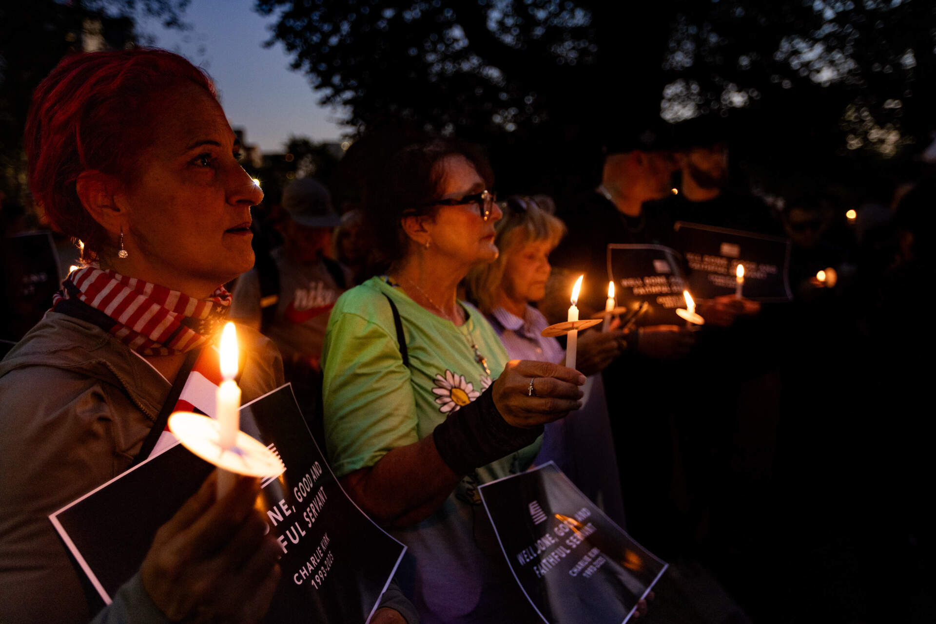 Attendees on Boston Common hold candles to mourn of the death of Charlie Kirk. (Jesse Costa/WBUR)