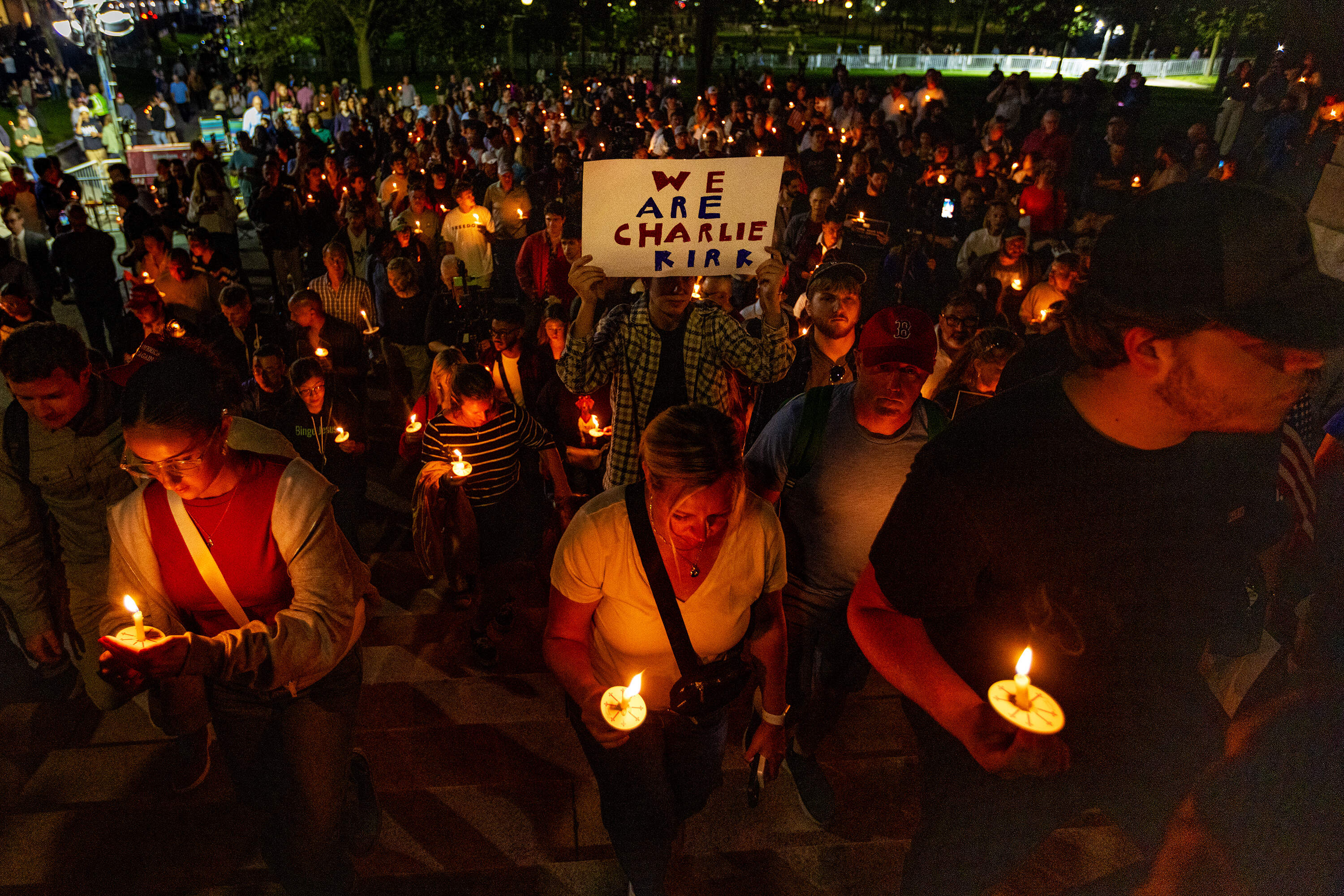 Vigil attendees begin walking up the stairs of the Boston Common to gather in front of the State House during the Prayer Vigil for Charlie Kirk. (Jesse Costa/WBUR)