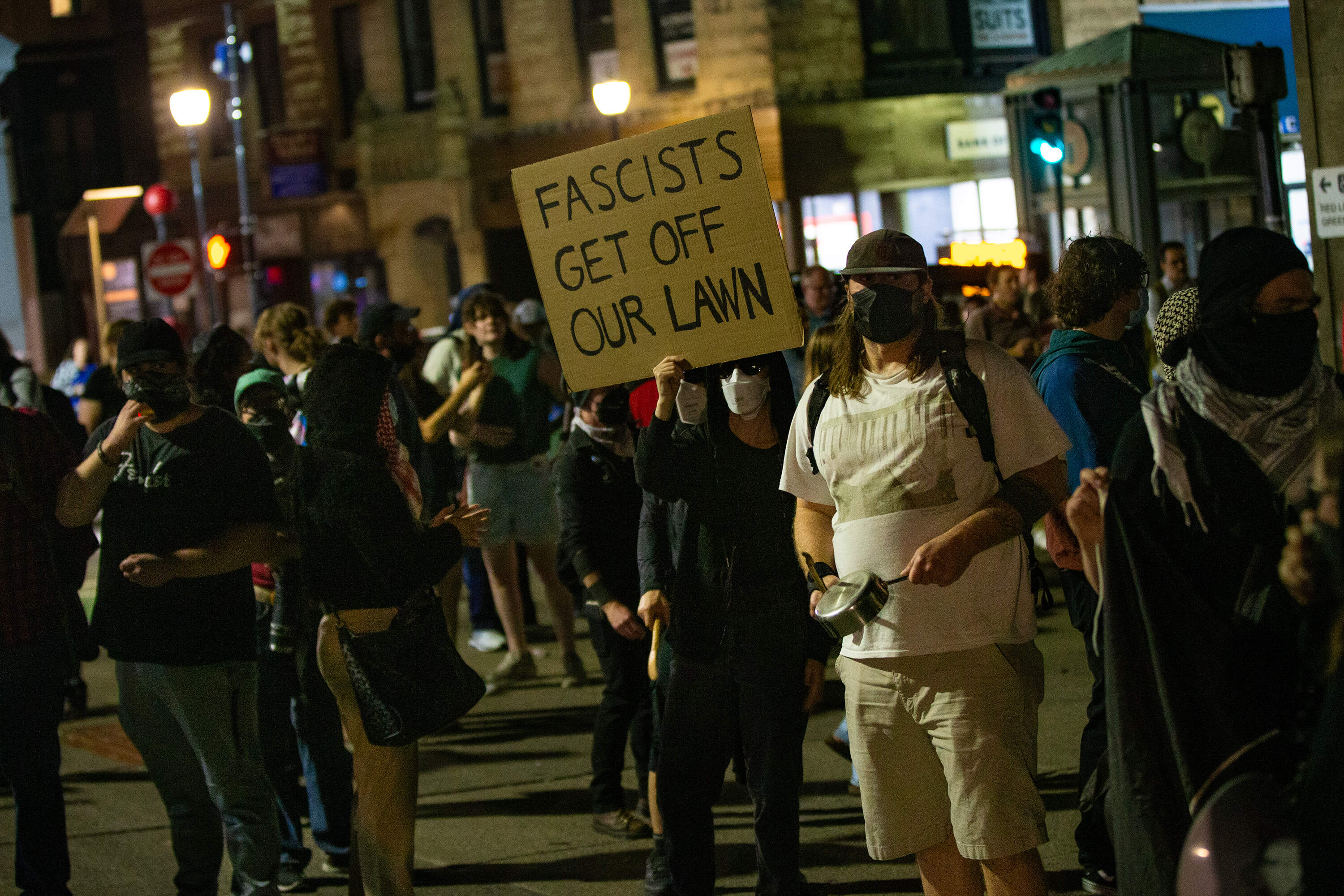 Anti-fascist protesters gather at Park Street Station on the opposite side of the Boston Common during the Prayer Vigil for Charlie Kirk. (Jesse Costa/WBUR)