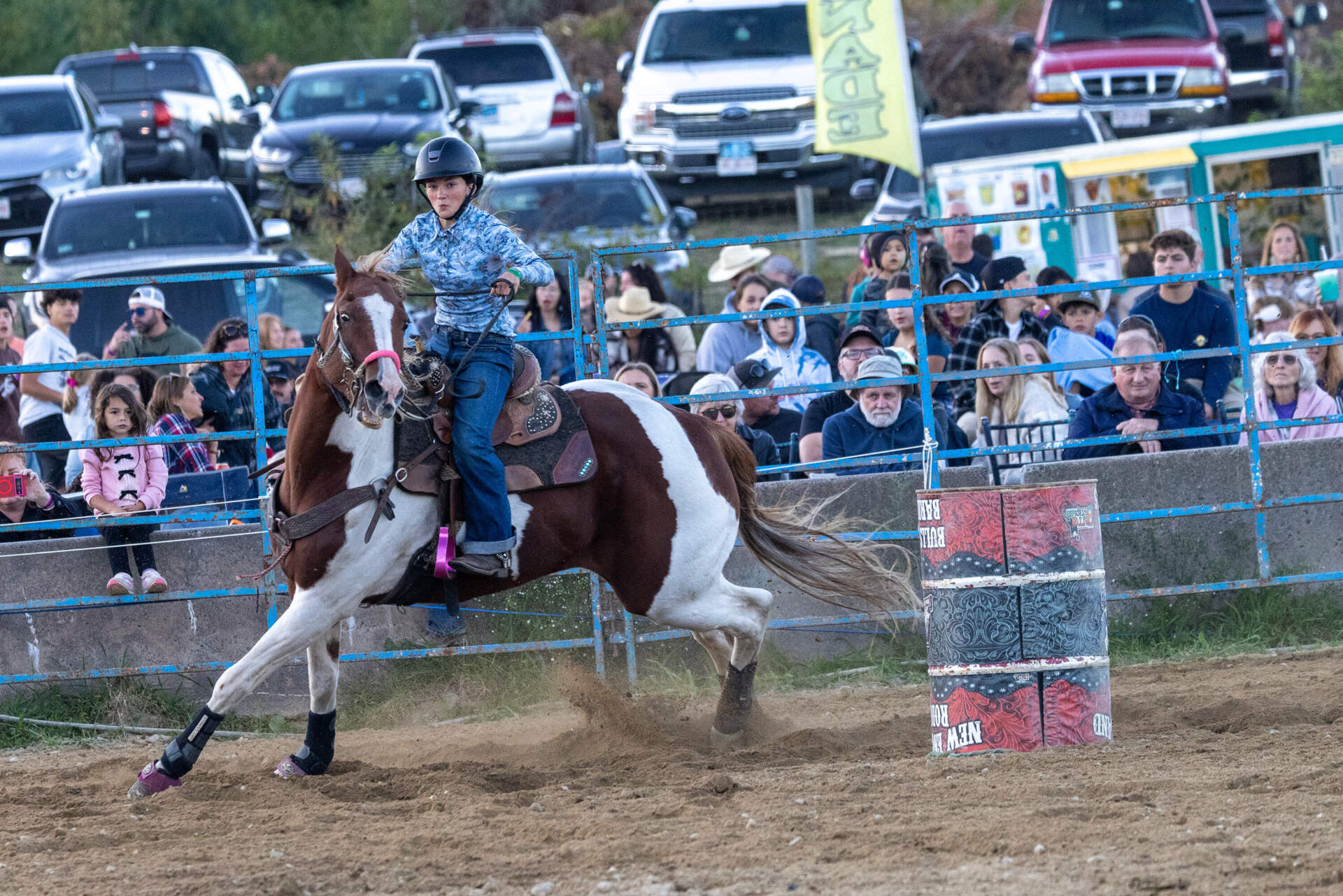 Tessa Edwards makes a turn around a barrel during the barrel race competition for juniors. (Jesse Costa/WBUR)