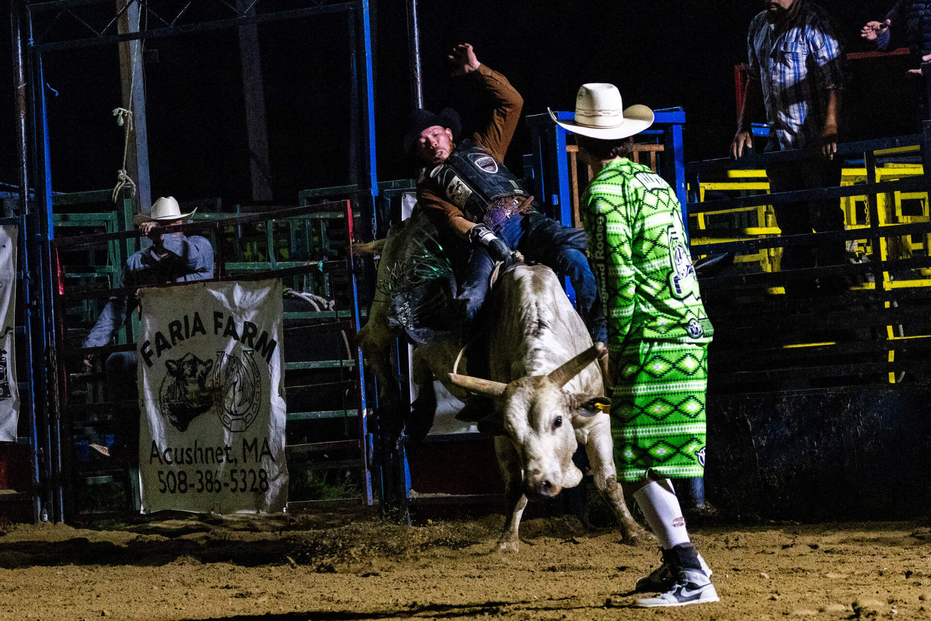 Wilquer Cruz rides Johnny Walker during the professional division of the bull riding competition. (Jesse Costa/WBUR)