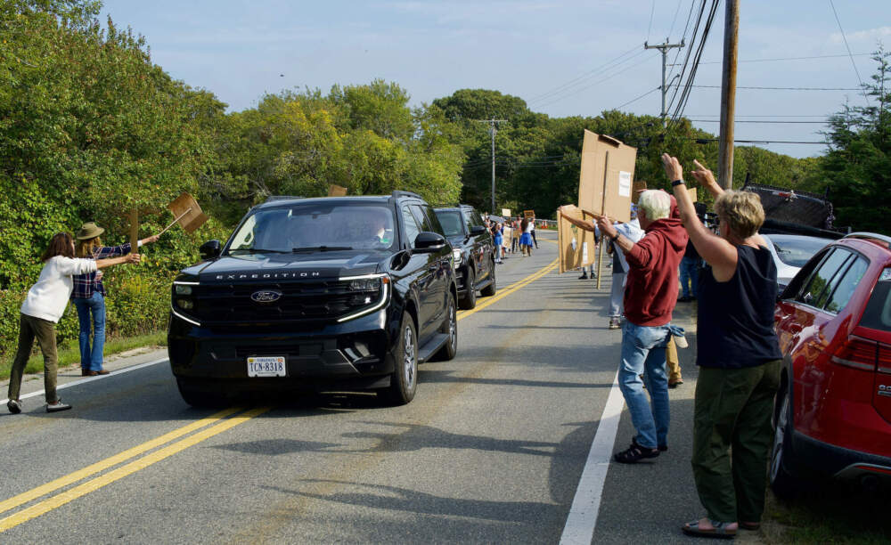 Protesters watch Human Health and Service's Secretary Robert F. Kennedy Jr.'s motorcade pass by on its way to a meeting with the Secretary Tribal Advisory Committee. September 23, 2025.