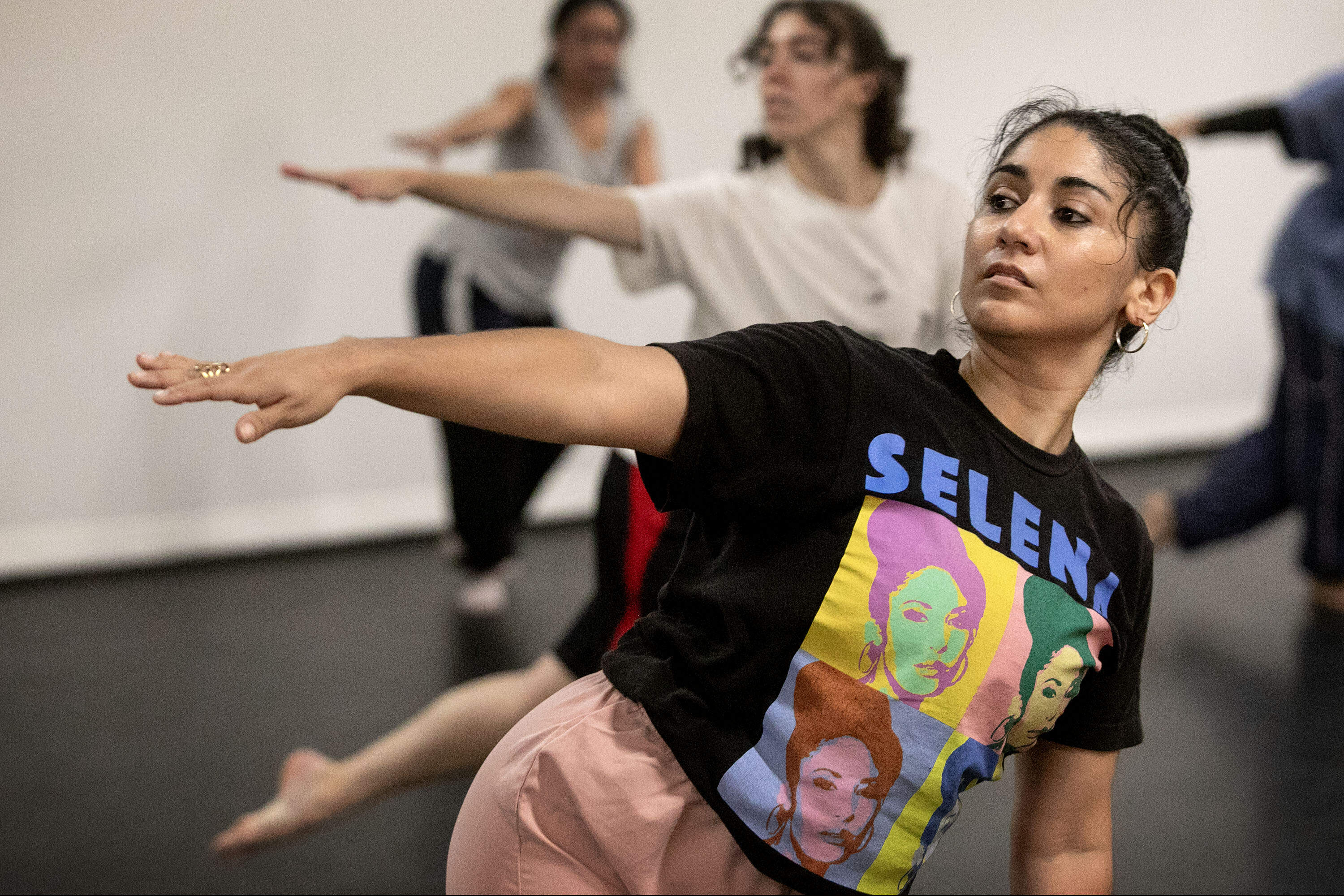 Marissa Molinar, the founder and director of MIDDAY Movement Series, dances at a MIDDAY class at SomArt Space at The Hive in Somerville. (Robin Lubbock/WBUR)