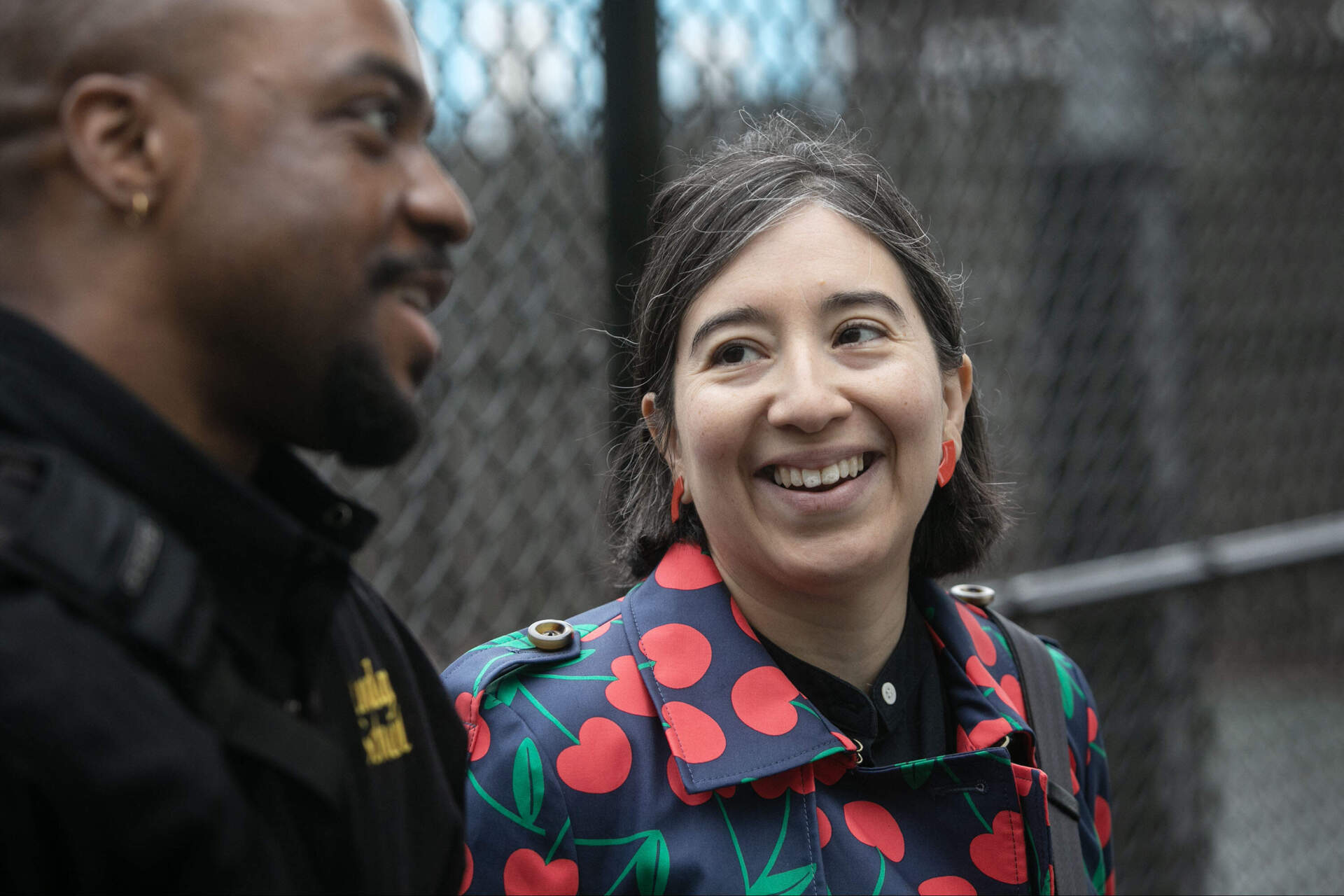 Cambridge Arts and Cultural Planning Director Claudia Zarazua talks with Brazier at Cambridge's Hoyt Park. (Robin Lubbock/WBUR)
