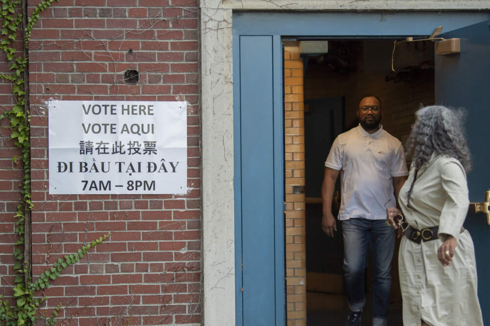 Voters depart after casting their ballots at the Higginson-Lewis K-8 School in Boston’s Ward 12 for the city's preliminary election. (Amanda Sabga for WBUR)
