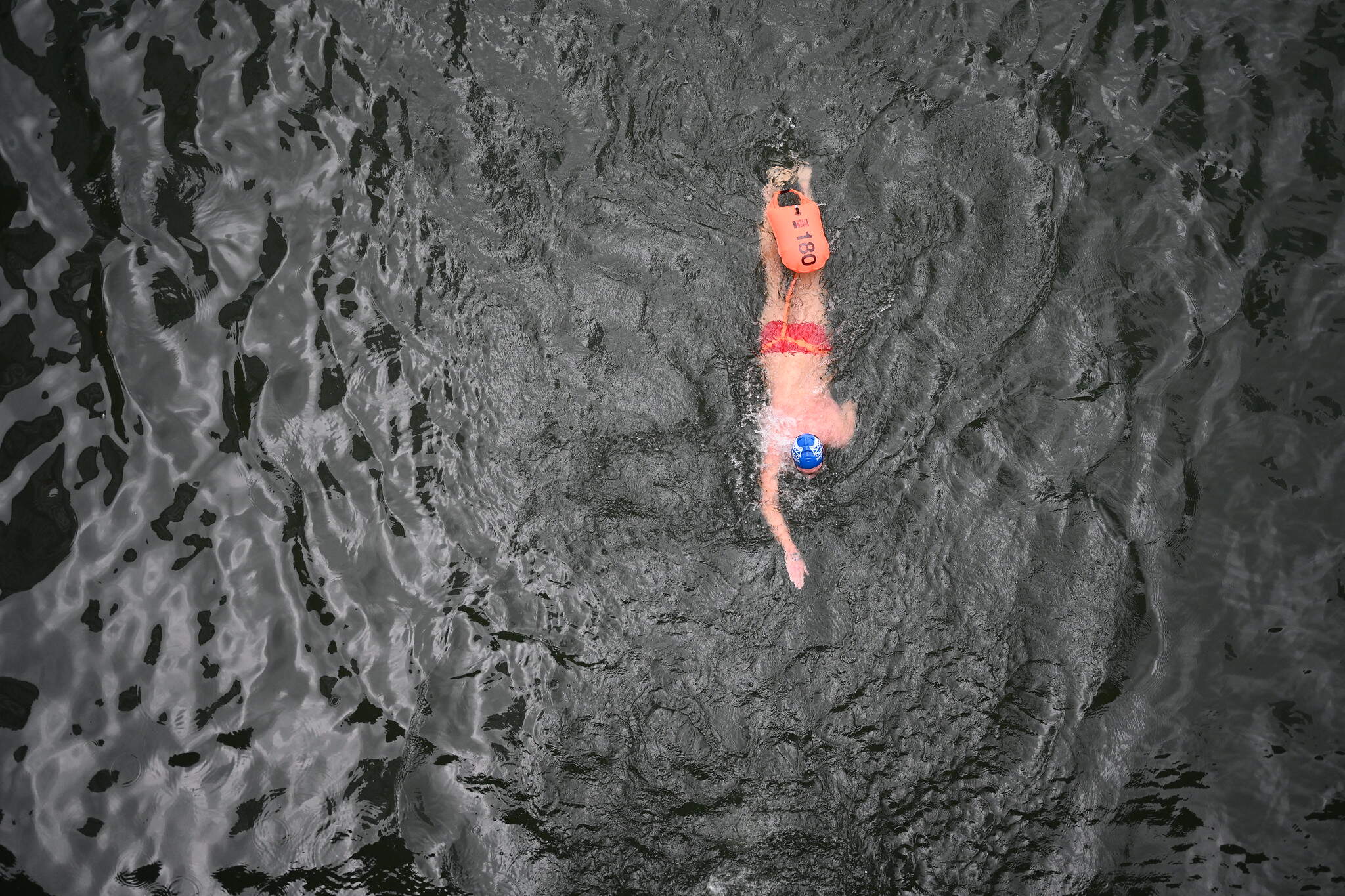 A swimmer competes in a race in the Chicago River. (Chris Bentley/Here & Now)