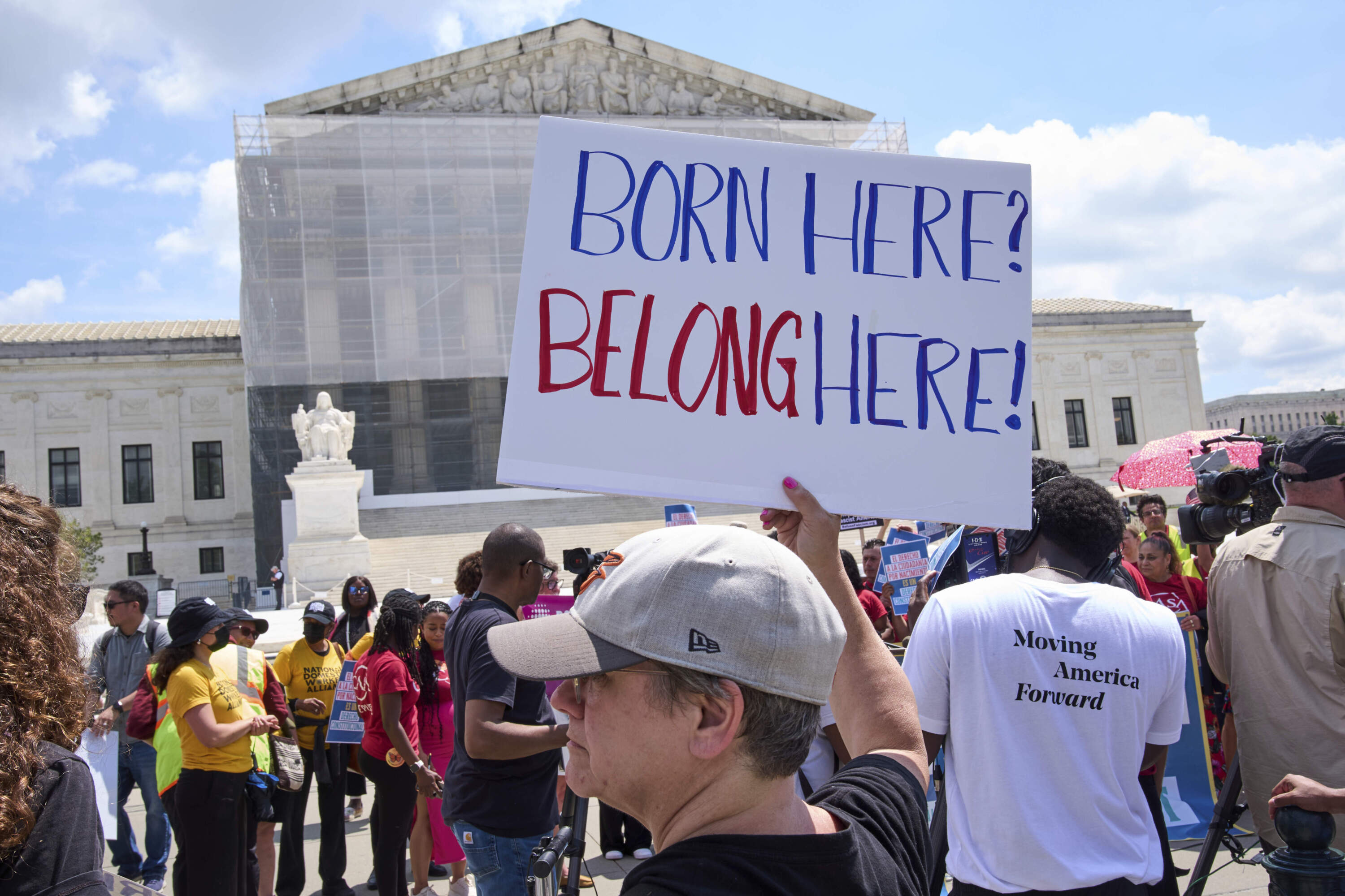 Jenny Harris, of Baltimore, protests in support of birthright citizenship and the immigrant community, Thursday, May 15, 2025, outside of the Supreme Court in Washington. (Jacquelyn Martin/AP)