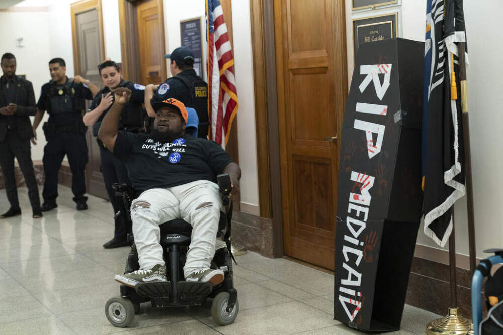 A demonstrator protests proposed Medicaid cuts outside the office of Sen. Bill Cassidy, R-La., on Capitol Hill, in Washington, D.C., on June 11. (Jose Luis Magana/AP)