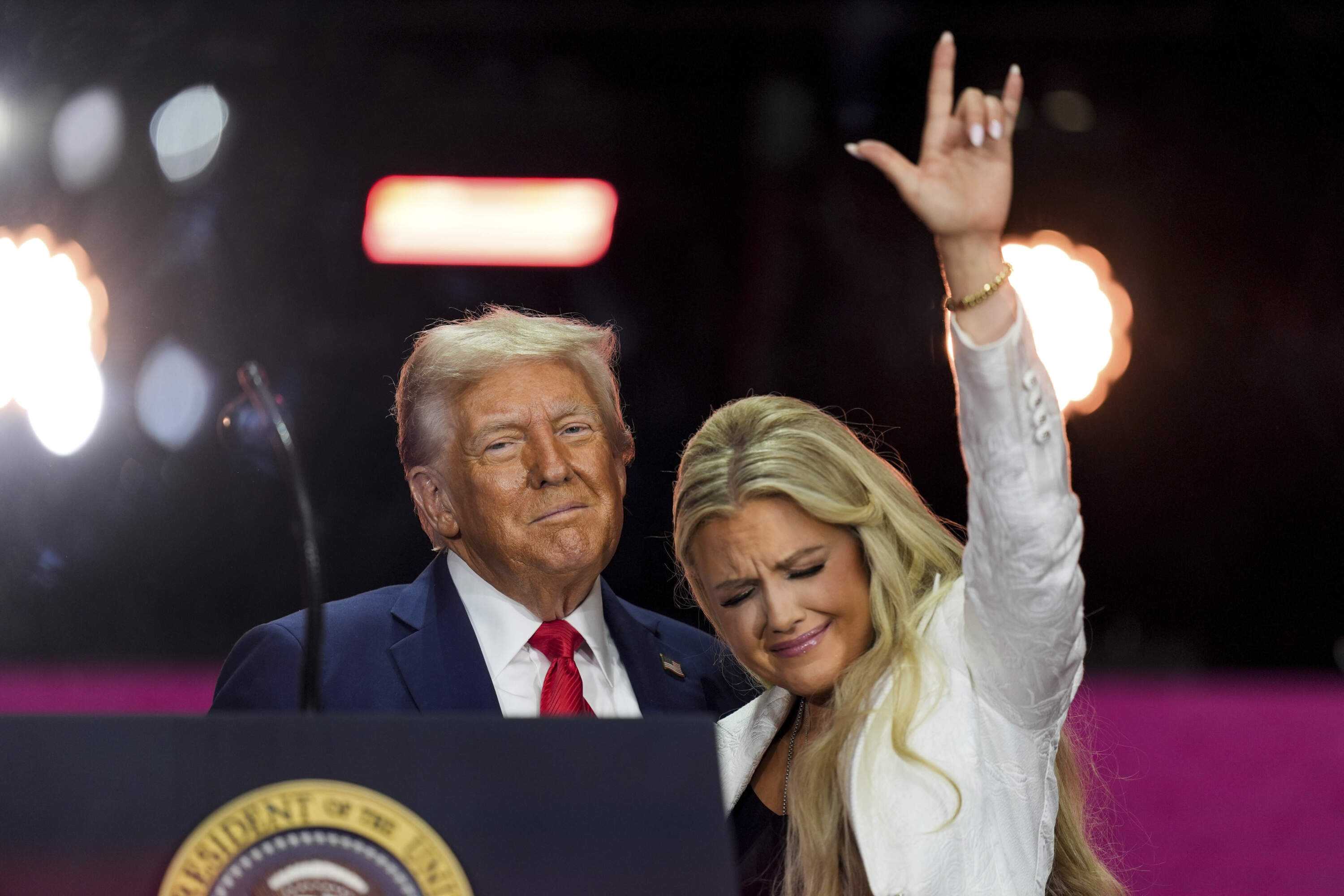 President Donald Trump, left, stands with Erika Kirk at the conclusion of a memorial for her husband, conservative activist Charlie Kirk, Sunday, Sept. 21, 2025, at State Farm Stadium in Glendale, Ariz. (Julia Demaree Nikhinson/AP)