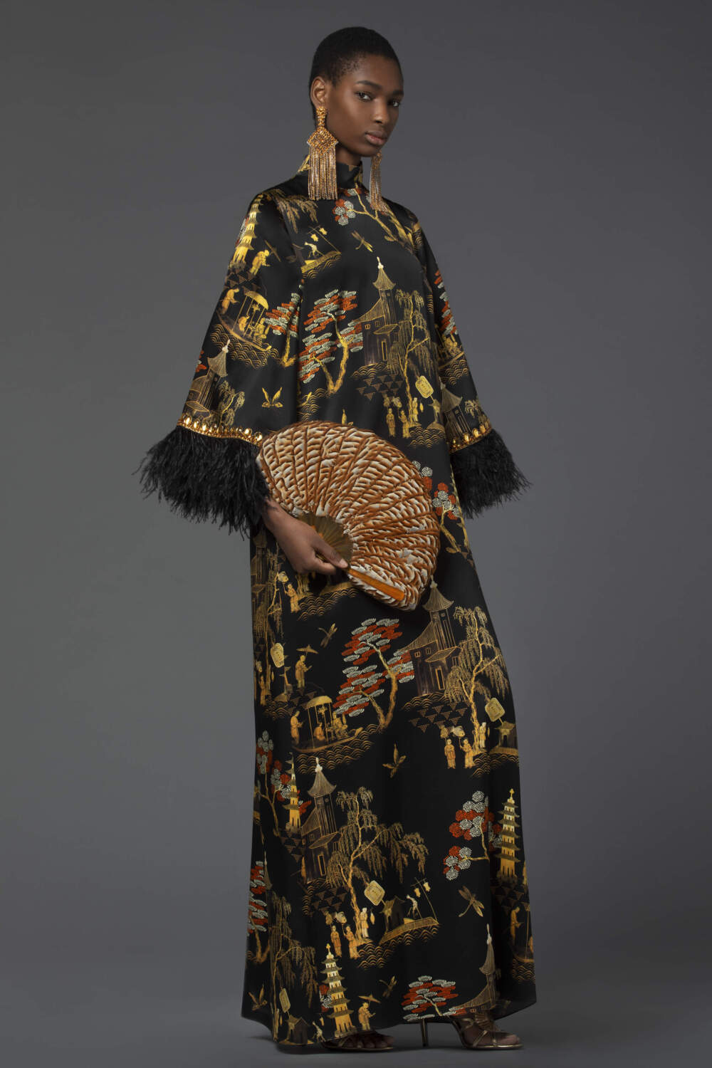 Andrew Gn, Coromandel print satin silk caftan with embroidered trim and ostrich feathers, 2021. Photo (Courtesy House of Andrew Gn/Peabody Essex Museum)