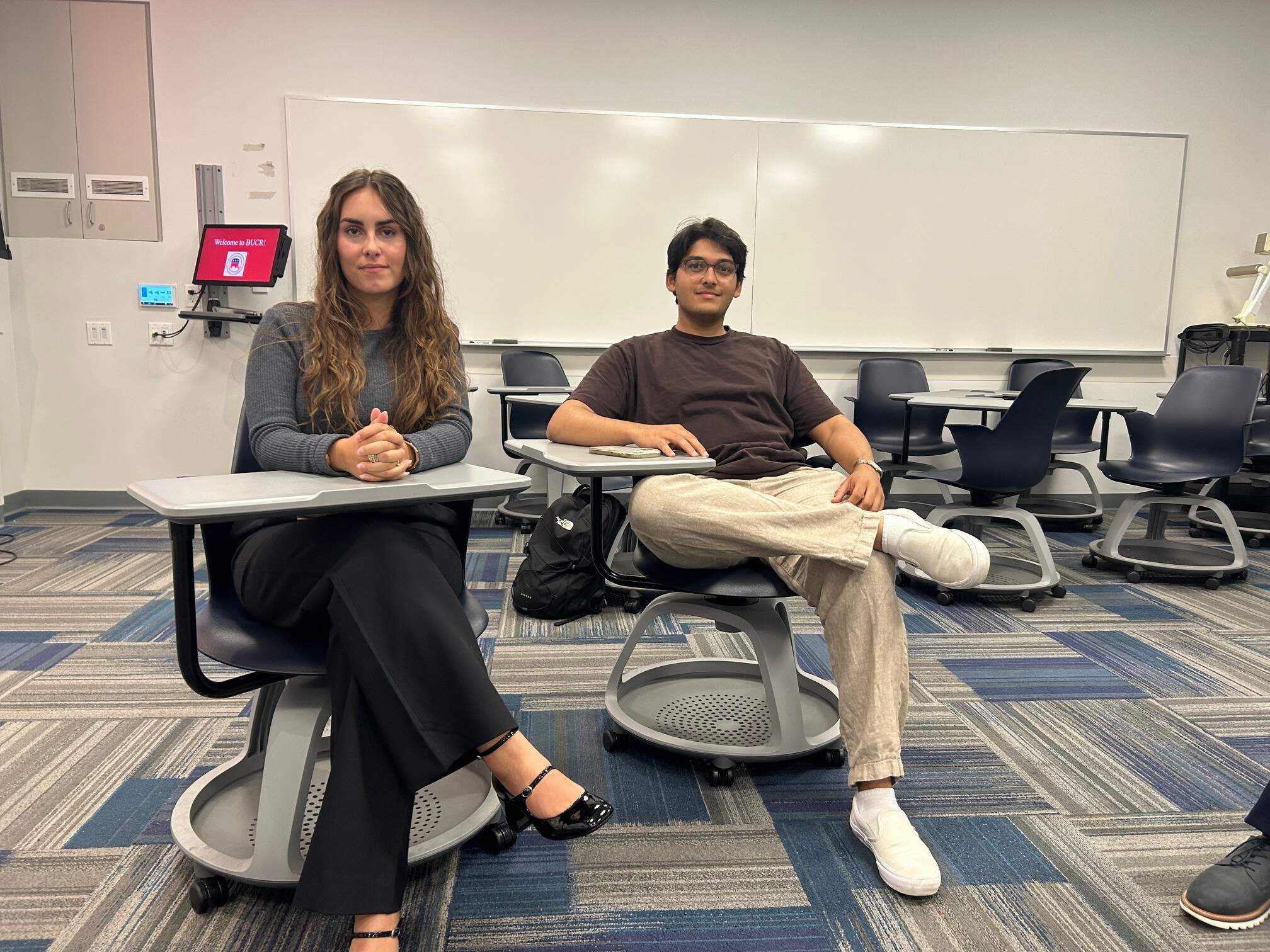 Julia Schultze and Soumil Mukherjee, attending a meeting with the Boston University College Republicans Monday night. (Anthony Brooks/WBUR)