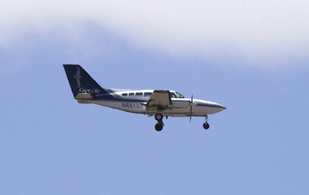 A Cape Air passenger plane — a Cessna 402 model — approaches Logan Airport in Boston in 2018.