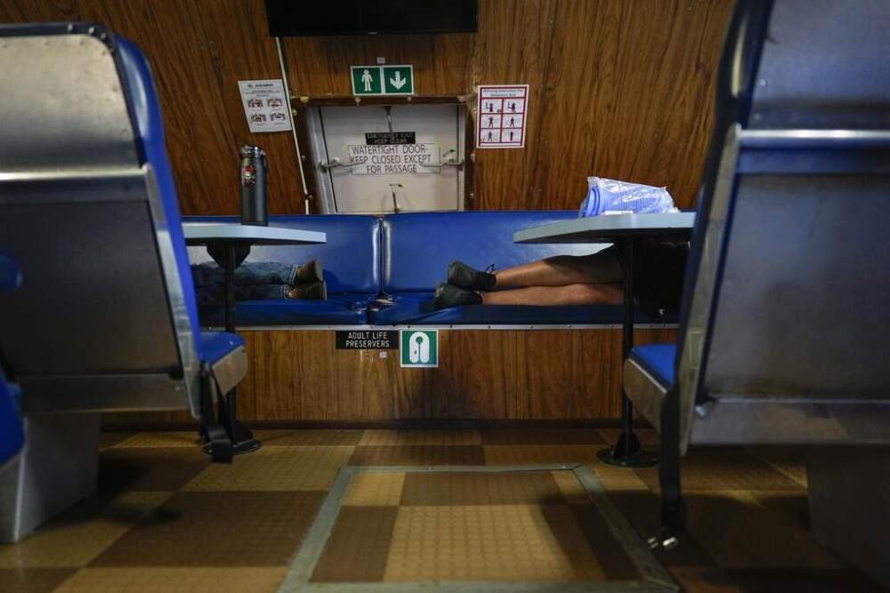 Expedition 501 members sleep on the Gaspee, a crew transport vessel, after leaving port in Fall River, Mass., during the eight-hour trip to the Liftboat Robert platform in the North Atlantic. (Carolyn Kaster/AP)