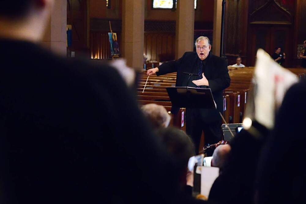 Coro Allegro artistic director David Hodgkins conducting. (Courtesy Hilary Scott)