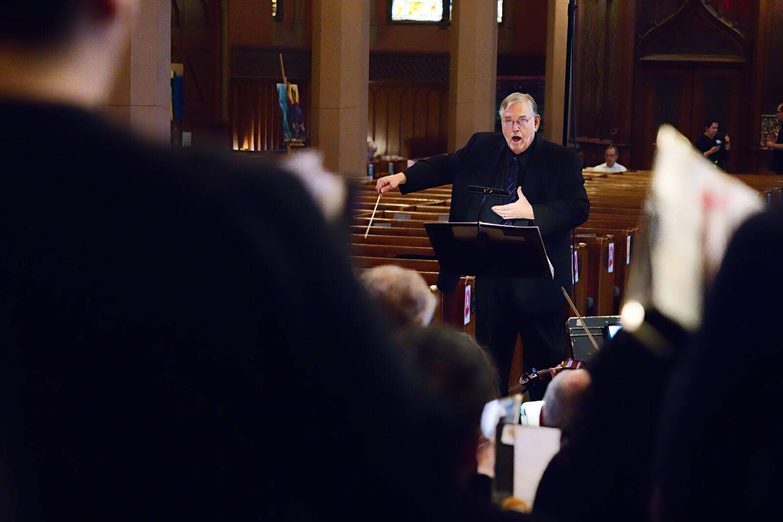 Coro Allegro artistic director David Hodgkins conducting. (Courtesy Hilary Scott)
