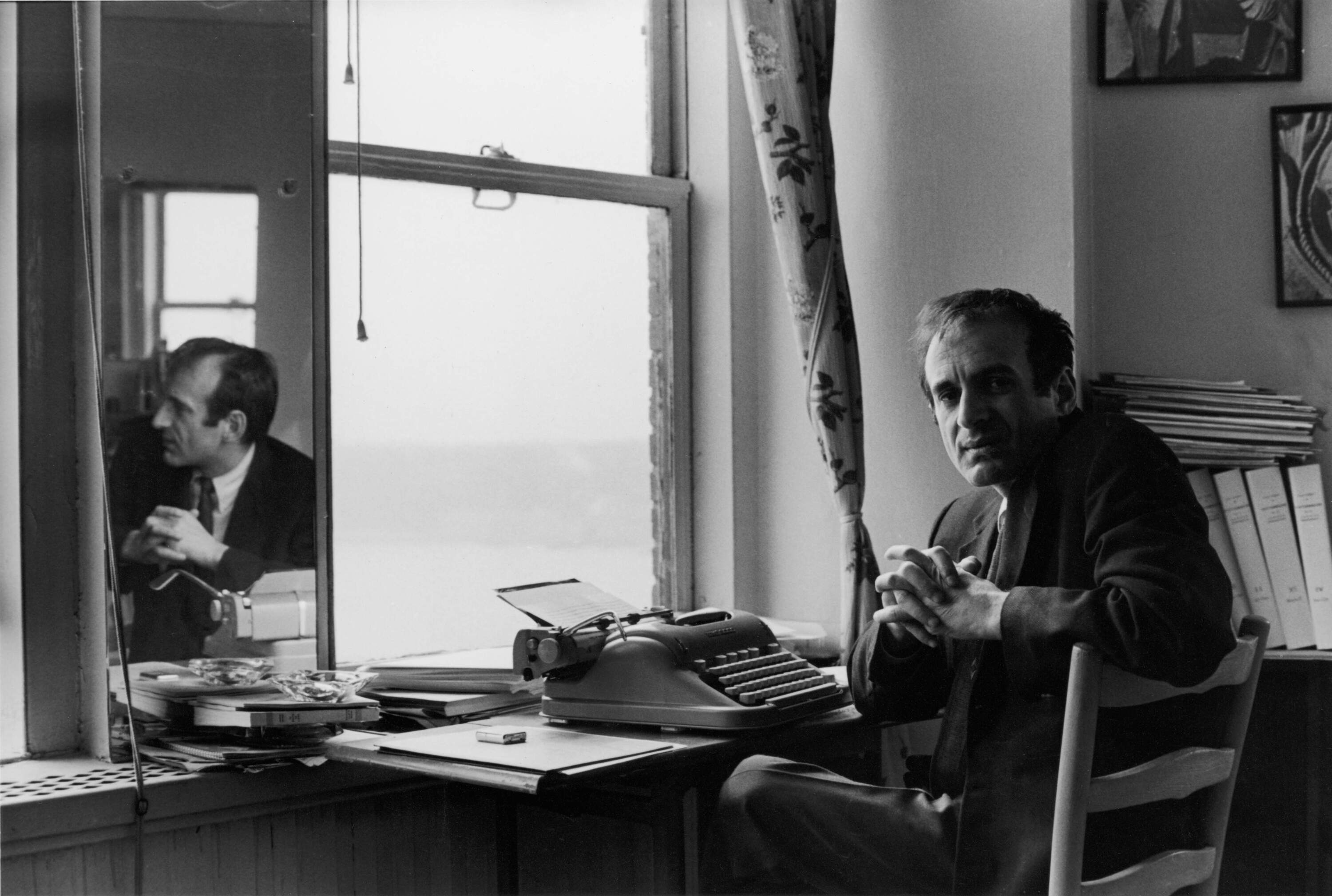 Portrait of Romanian-born Nobel laureate, author, and Holocaust survivor Elie Wiesel as he sits at a typewriter, 1960s. (Bernard Gotfryd/Getty Images)