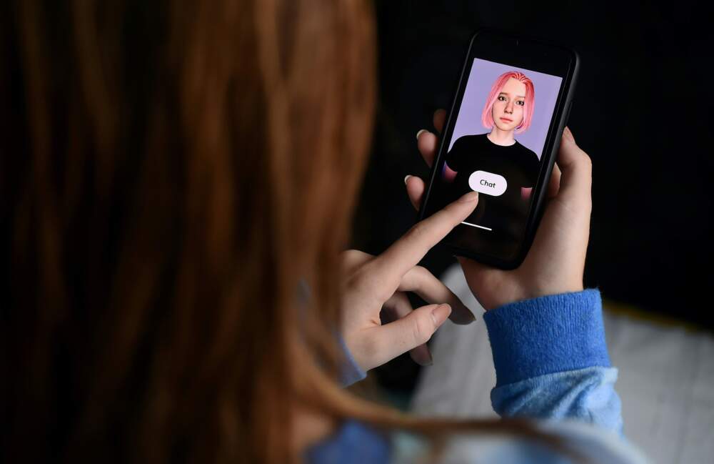 A virtual friend is seen on the screen of an iPhone.(Olivier Douliery/AFP via Getty Images)