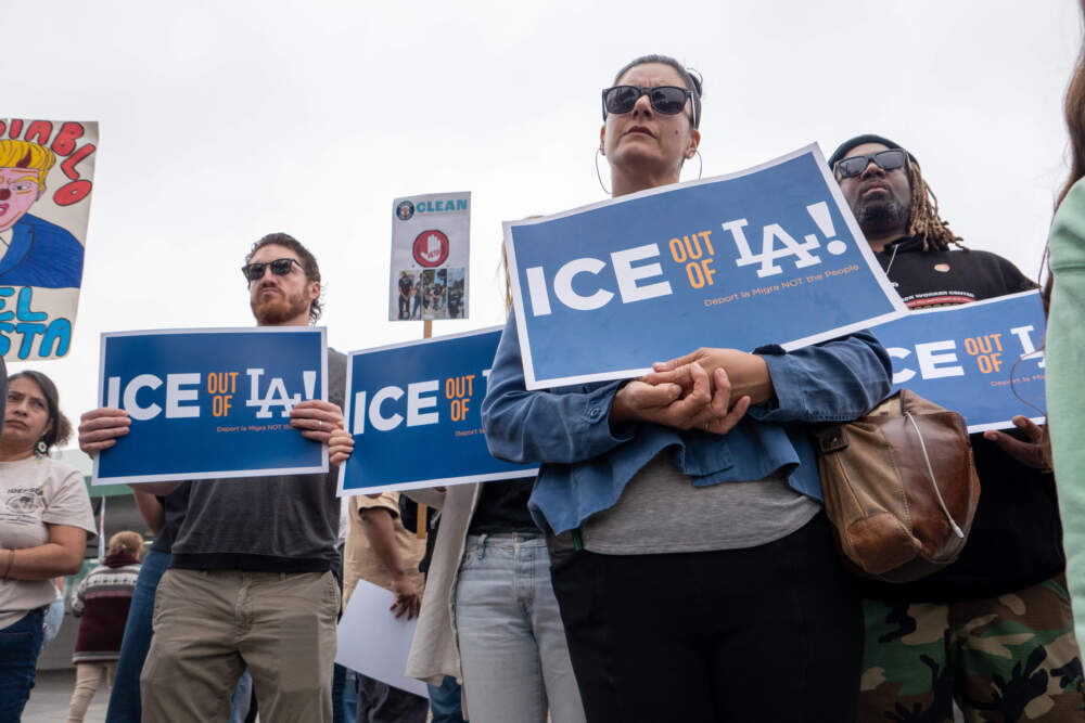 People attend a news conference and rally at a closed car wash where workers were detained in U.S. Immigration and Customs Enforcement (ICE) raids in West Los Angeles over the weekend on June 11, 2025, in Los Angeles, California. (Spencer Platt/Getty Images)