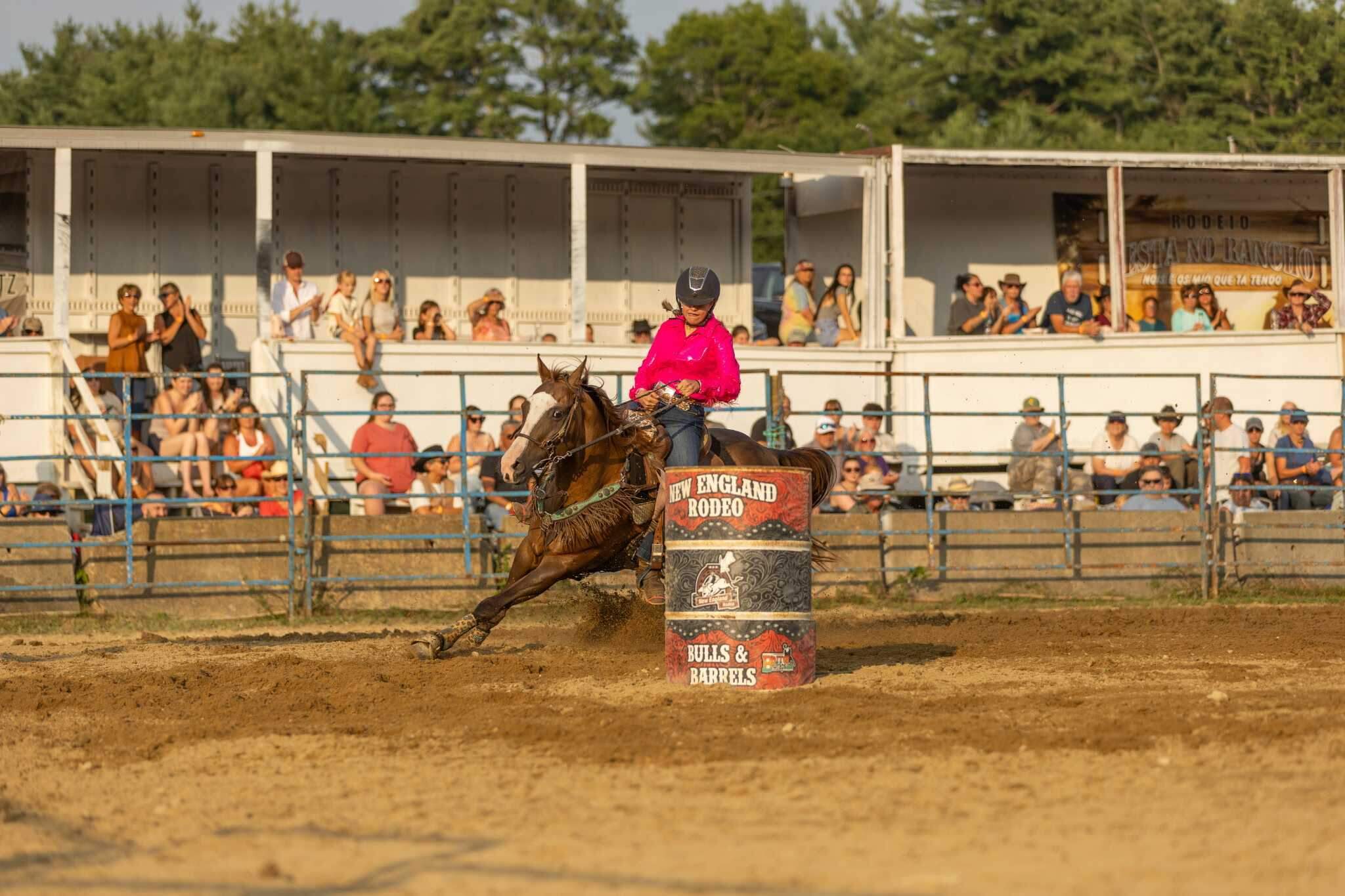 Bull riding and barrel racing, shown here, are the two main attractions at the New England Rodeo. (Jenn Carmichael/Flex It Photography)
