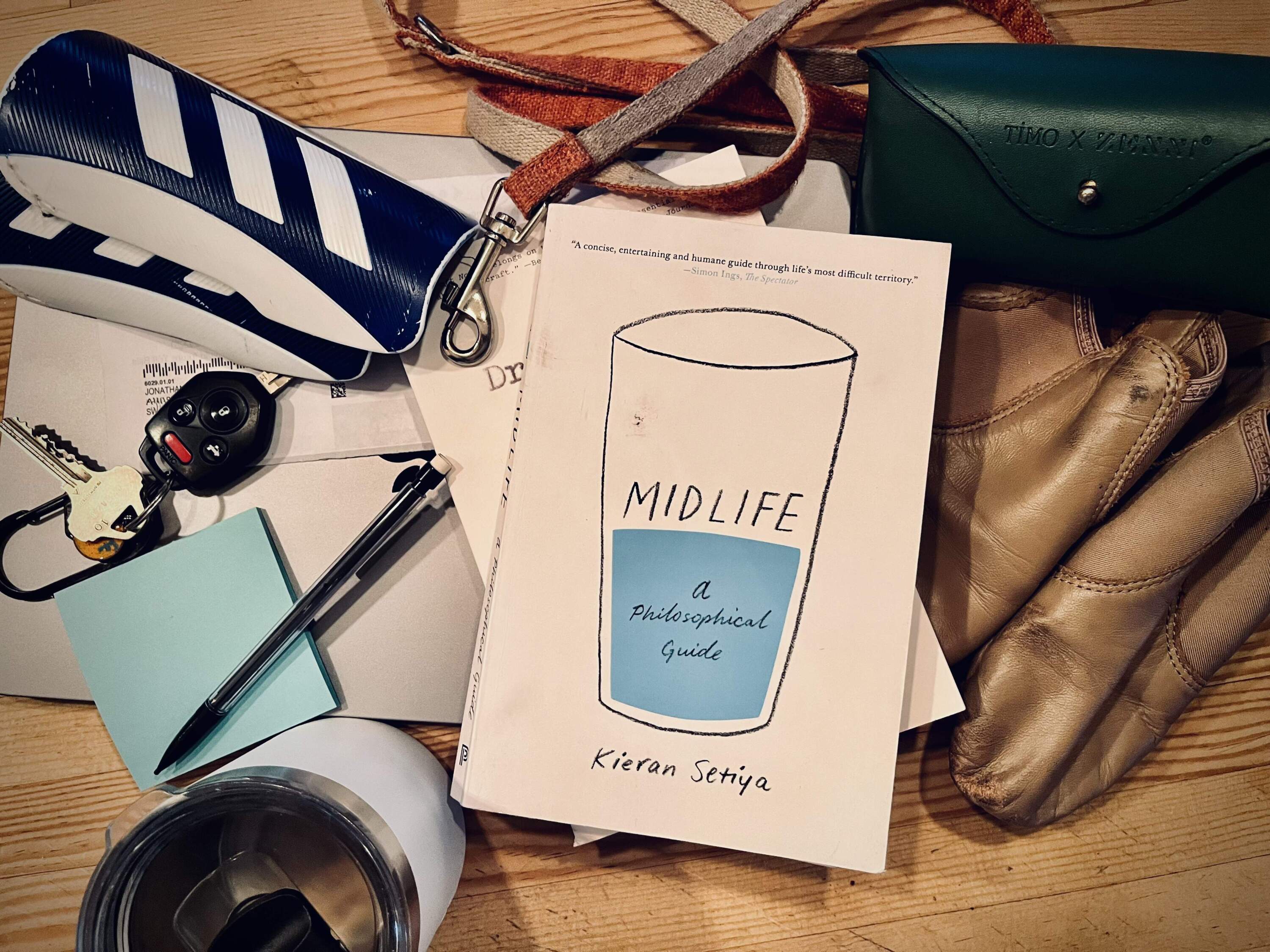 A collection of midlife management detritus, including the book "Midelife: A Philosophical Guide," by Kieran Setiya. (Courtesy Jonathan D. Fitzgerald)