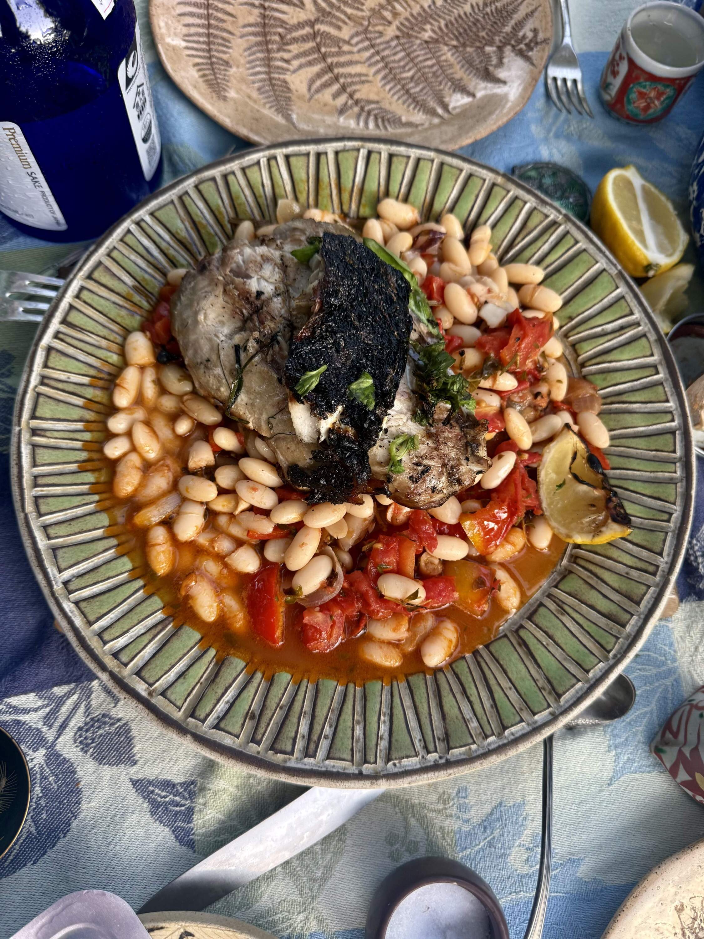 White beans with tomatoes and herbs with grilled fish. (Kathy Gunst/Here & Now)