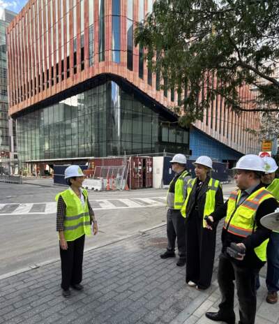 Global Arts Live CEO Connie C. Chin speaks with visitors before a walkthrough of The Platform, which is under construction. (Courtesy Global Arts Live)