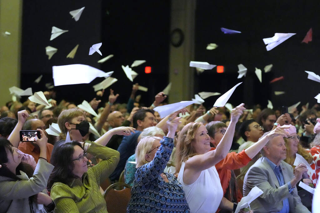 Audience members toss paper airplanes during the Ig Nobel Prize award ceremony, Thursday, Sept. 18, 2025, in Boston. (Robert F. Bukaty/AP)