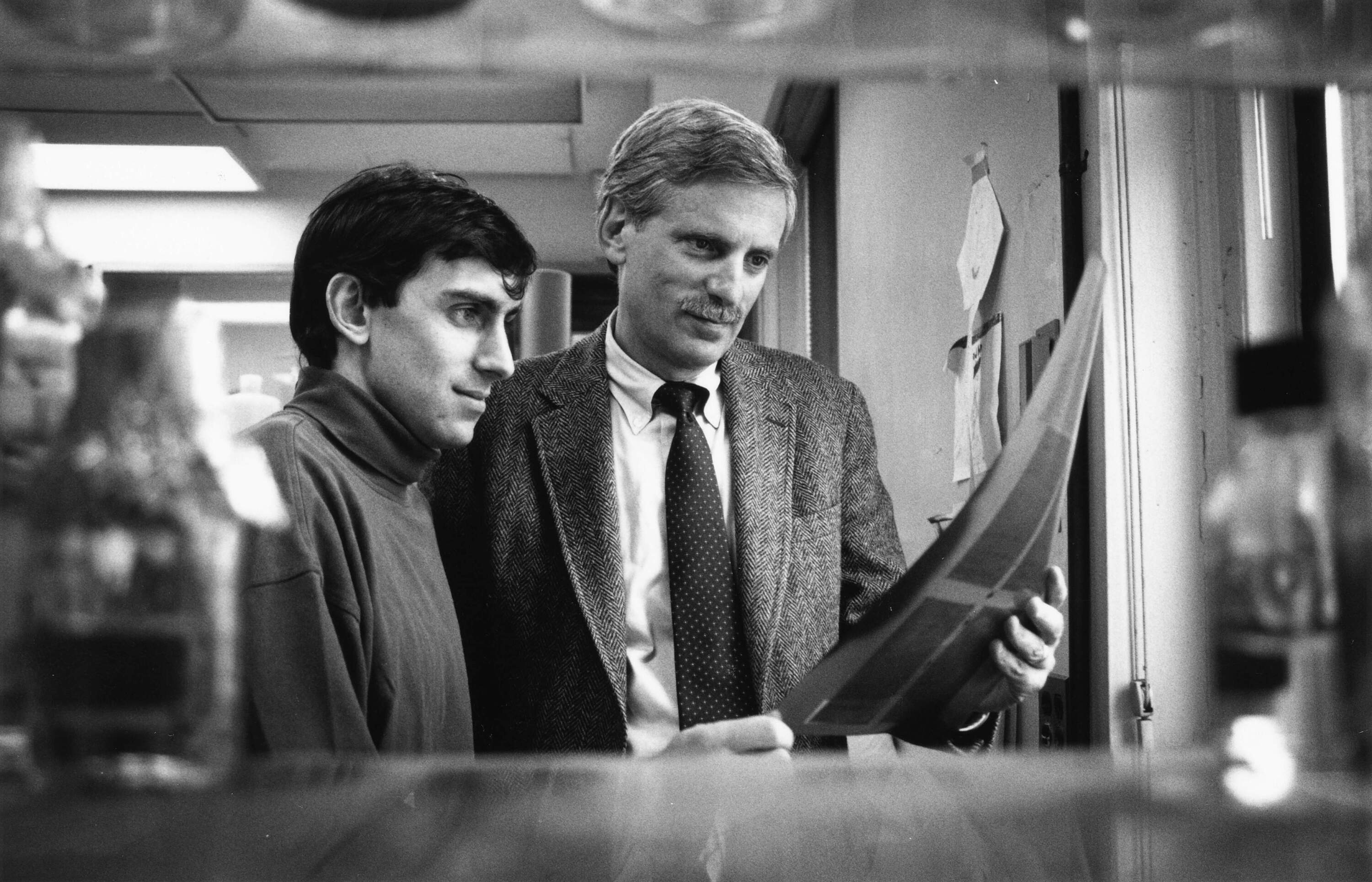 1992: Rockefeller University Professor Jan Breslow (right) and Postdoctoral Associate Andrew Plump conducted research that resulted in the first transgenic mouse model of atherosclerosis, a major breakthrough in the study of this lethal disease. <br />Source: Rockefeller University, <a href="https://digitalcommons.rockefeller.edu/search_magazine/13/">Search Magazine</a>, vol.4, no.1